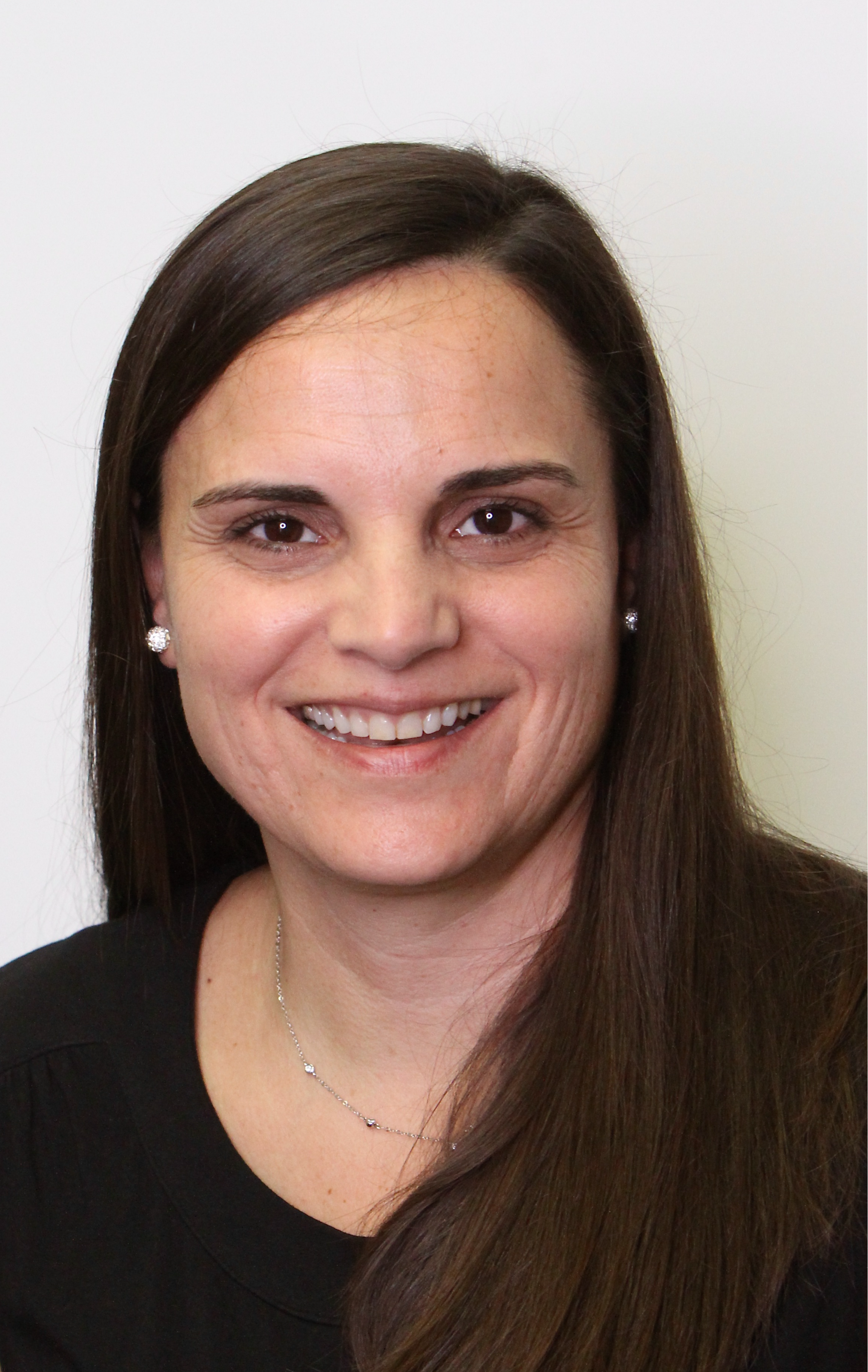 Photo of lady with long dark hair, black shirt