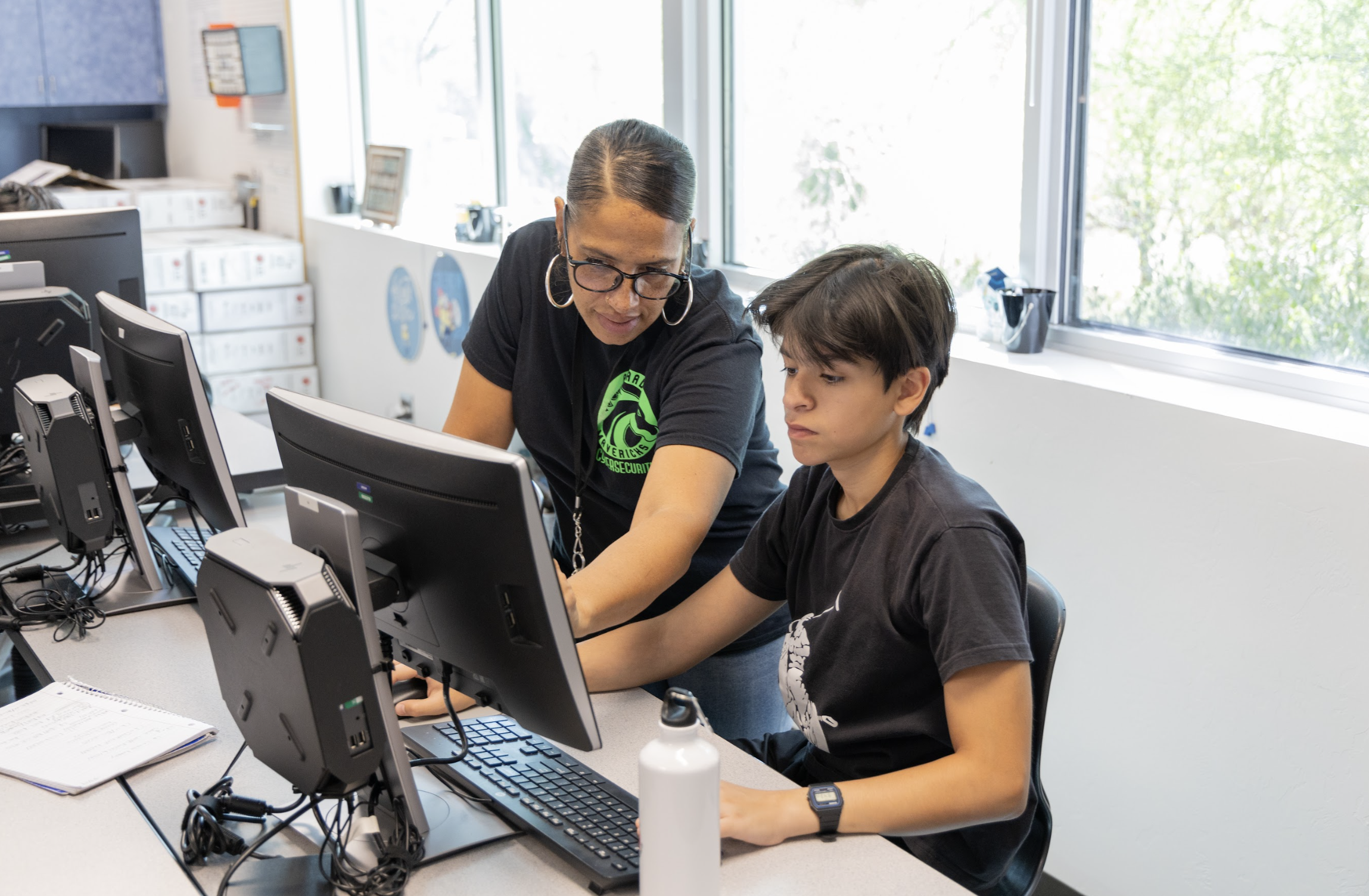 Mrs. Matias helping Cybersecurity student 