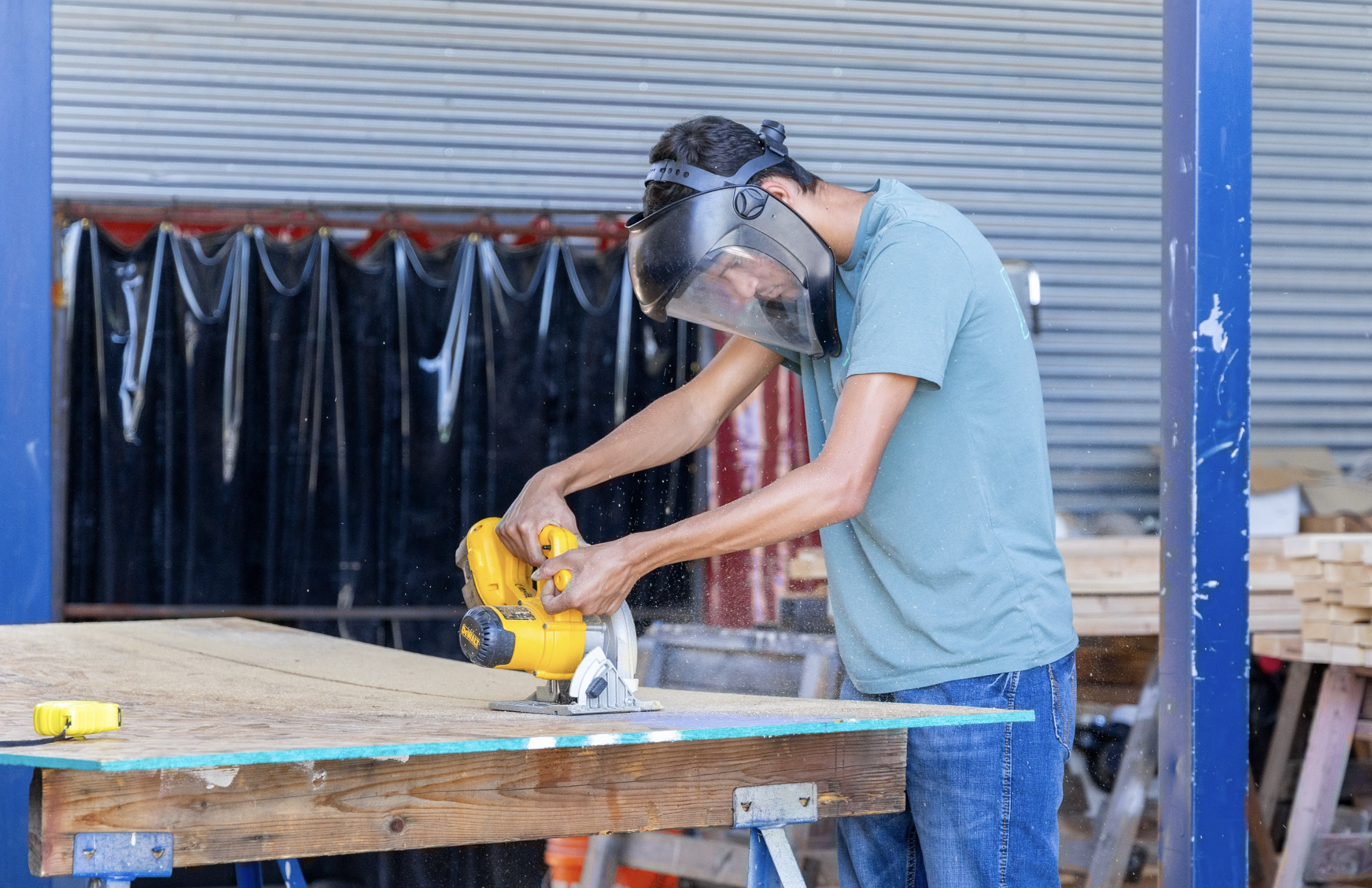 Construction Student working on sanding