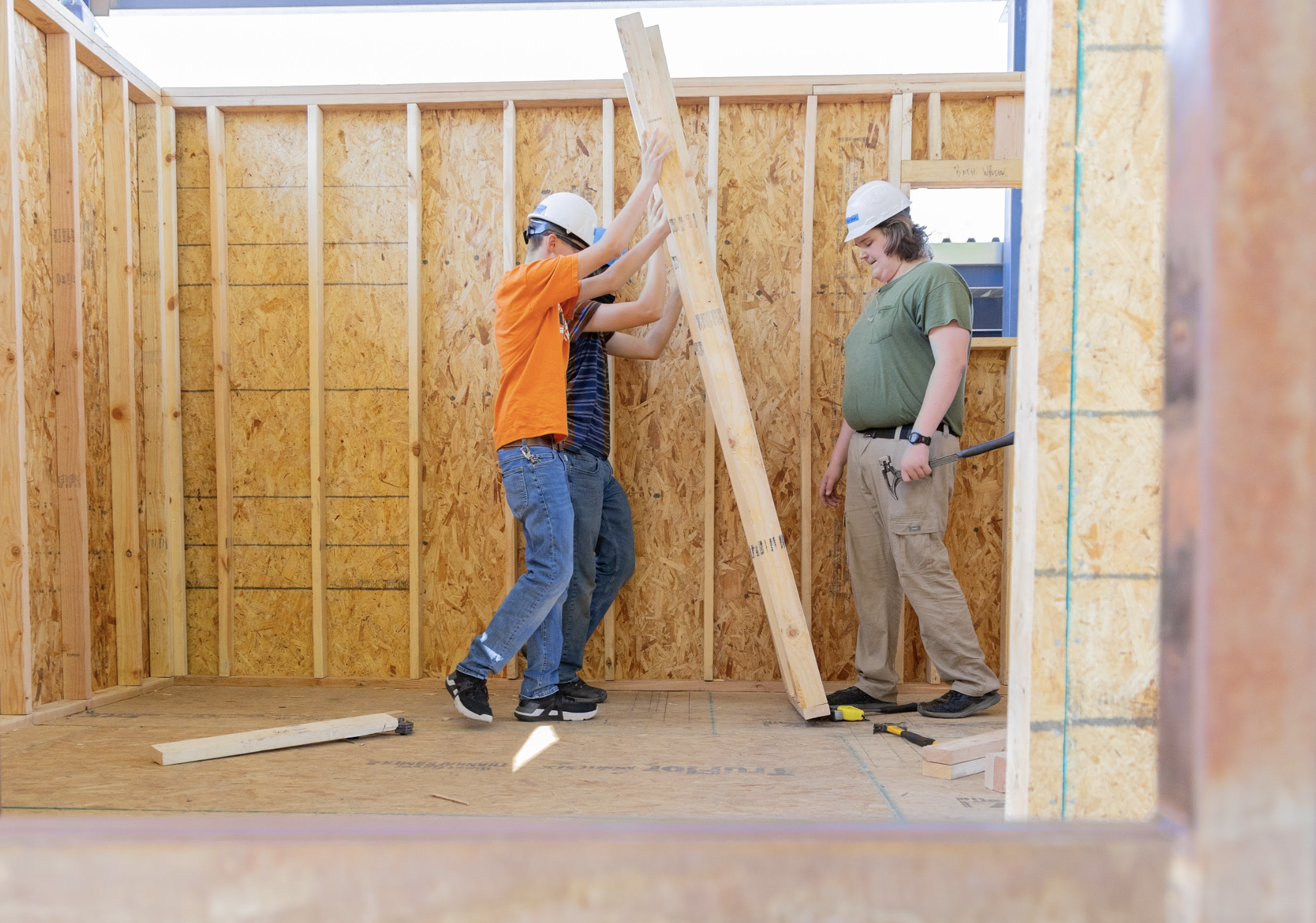 Construction Students putting up a wall