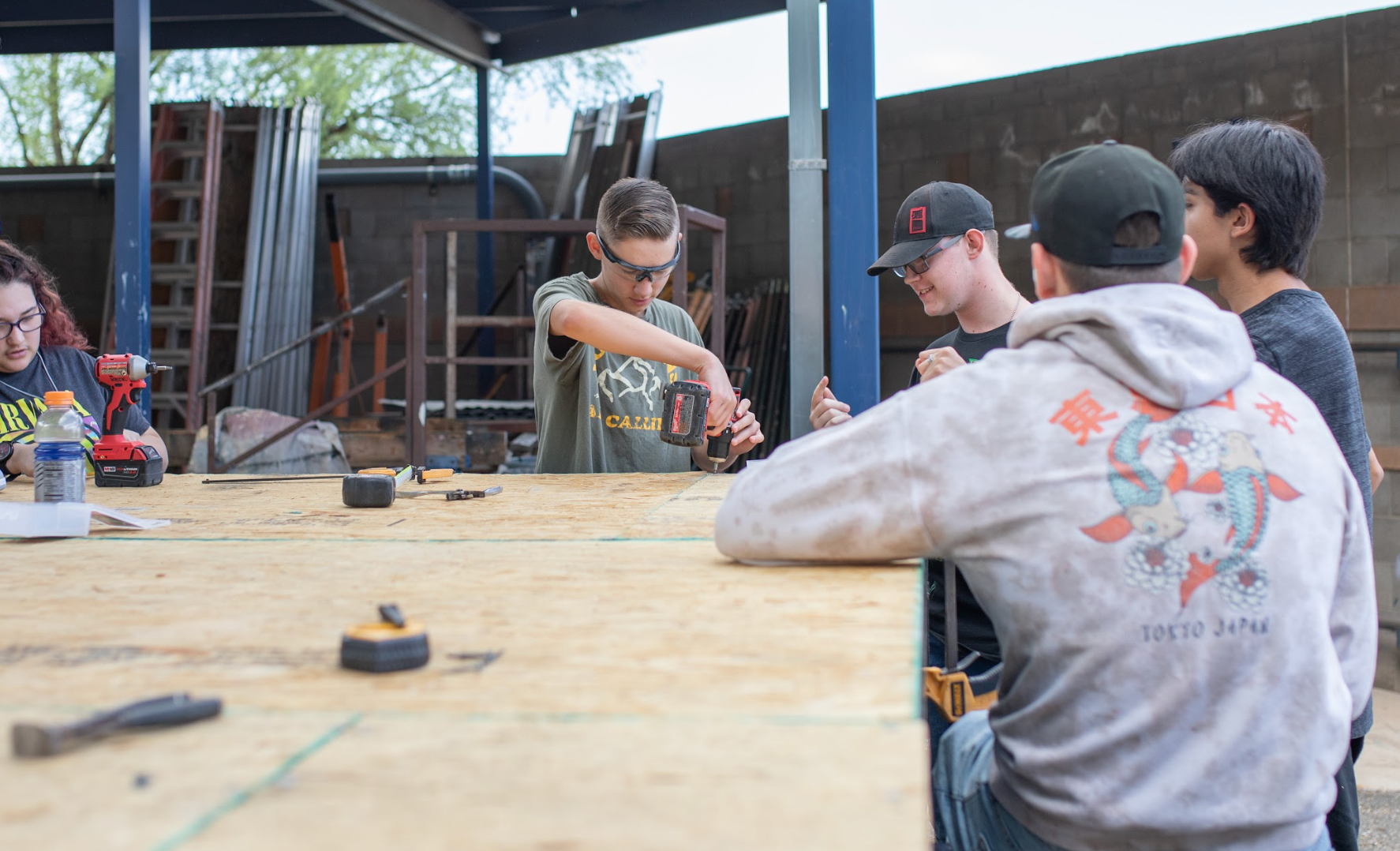 Construction Student using a drill