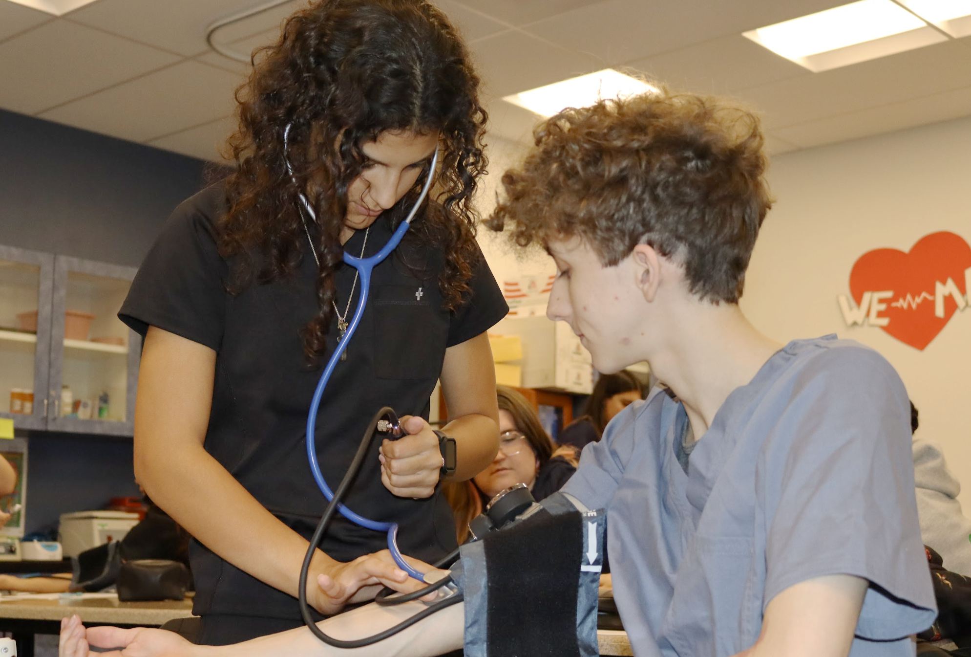 CTE students practicing blood pressure