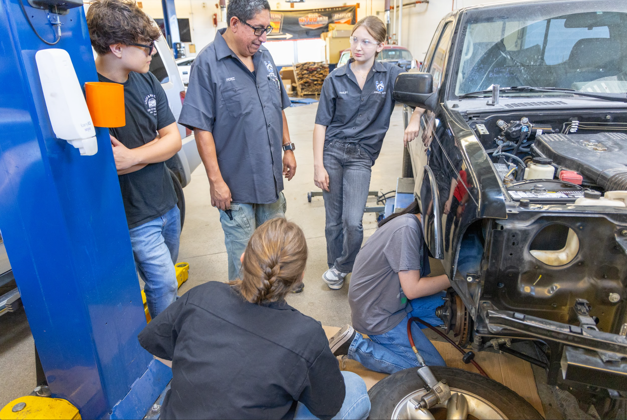 CTE Student working under a car