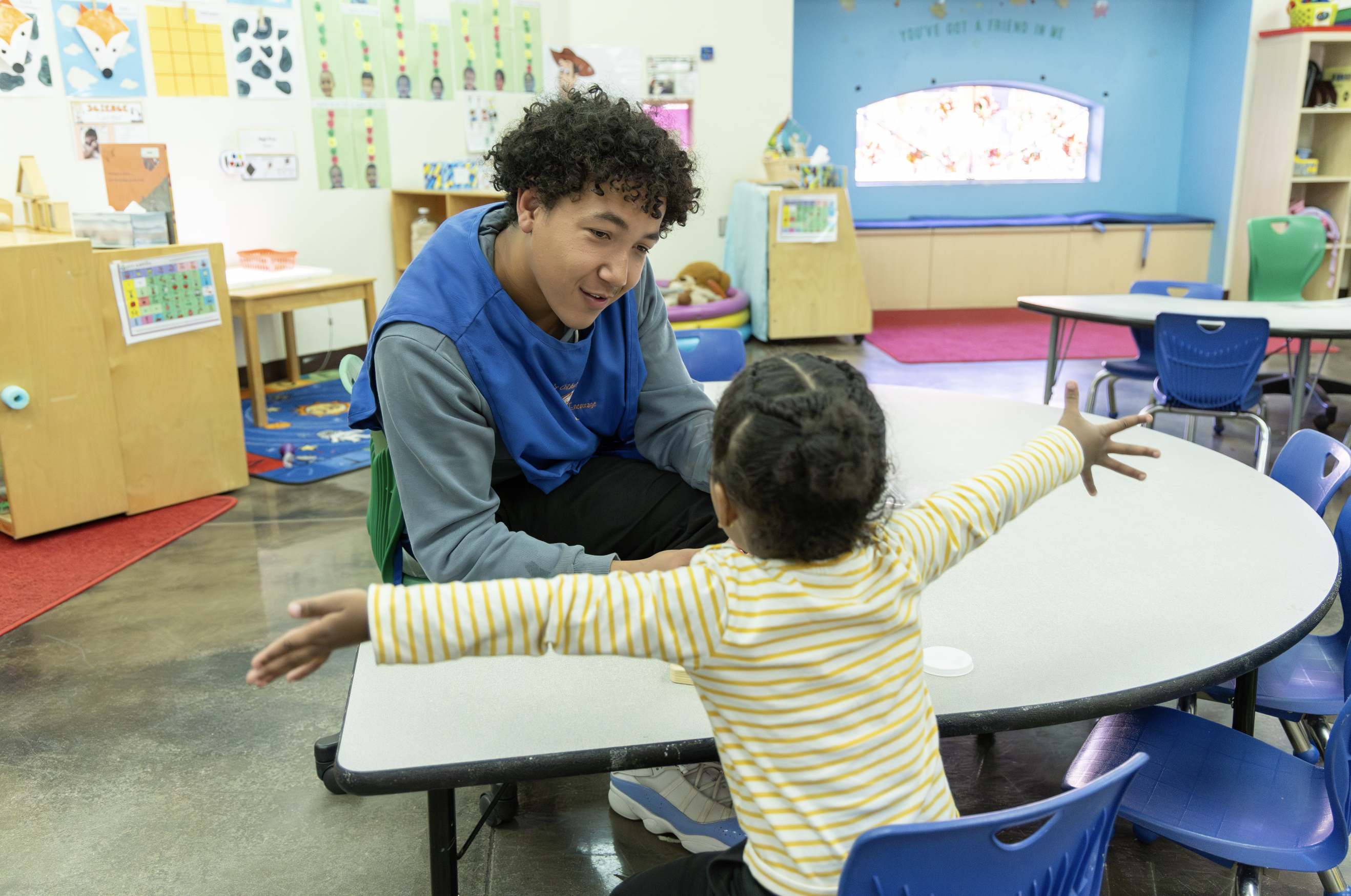 ECE Students playing with a preschooler