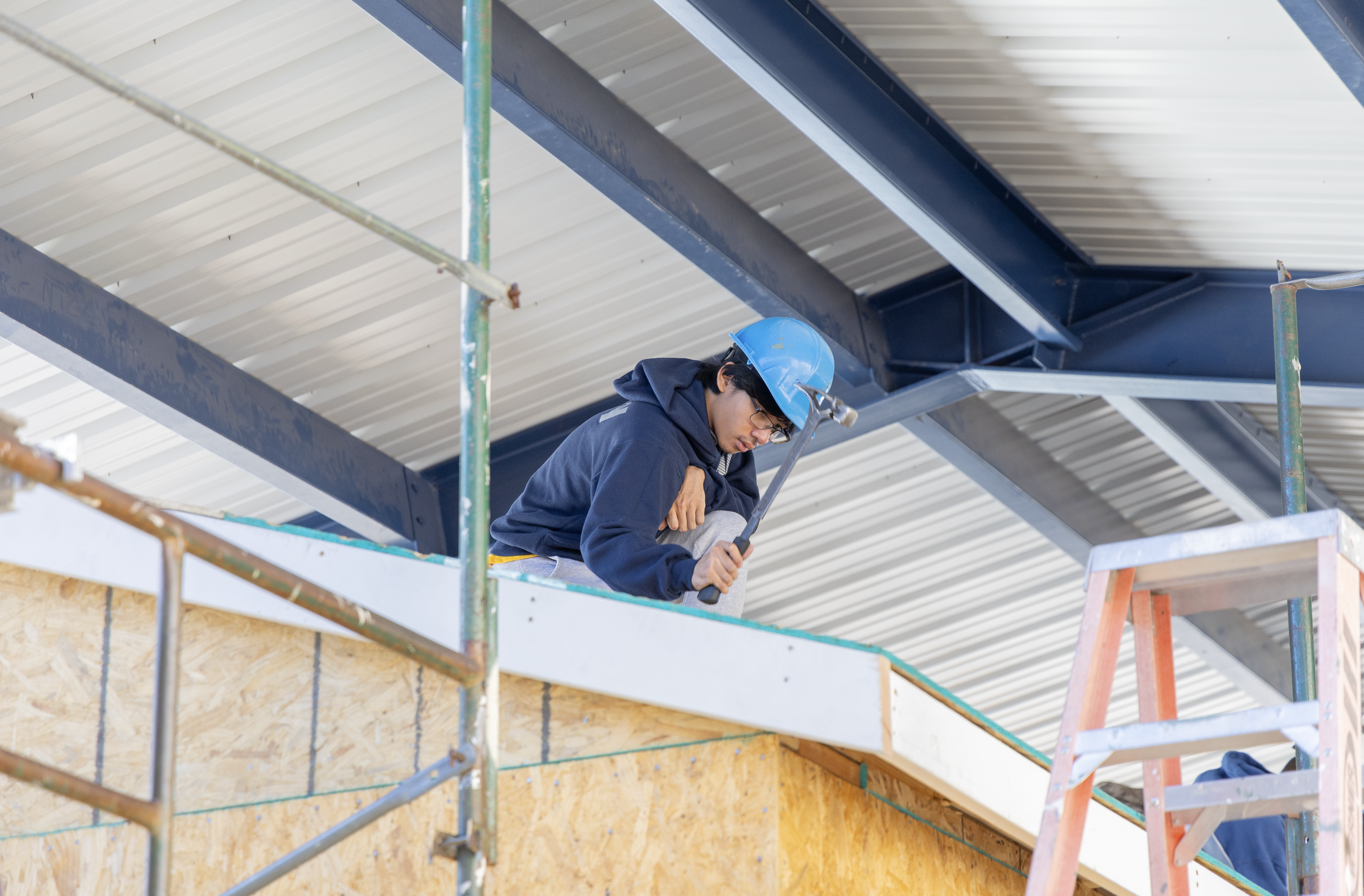 Construction Student working on building