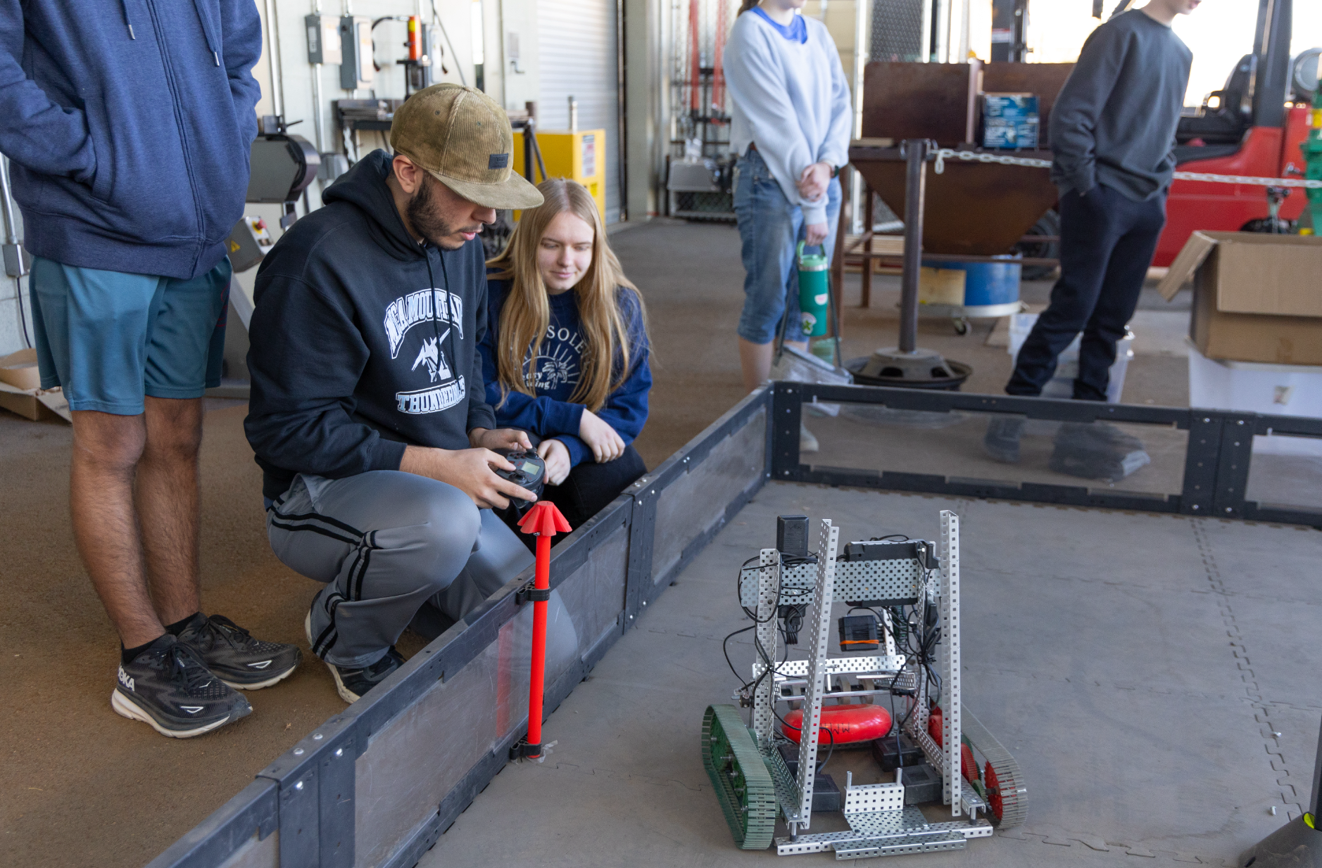 Engineering CTE students working on their robotic cars