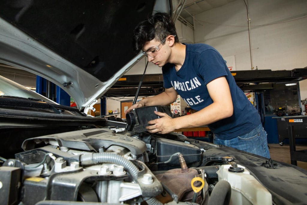 CTE Student checking a car engine