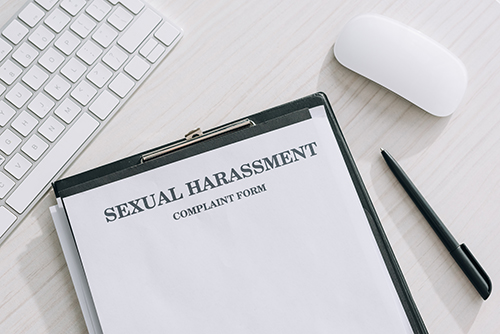 sexual harassment report on a clipboard