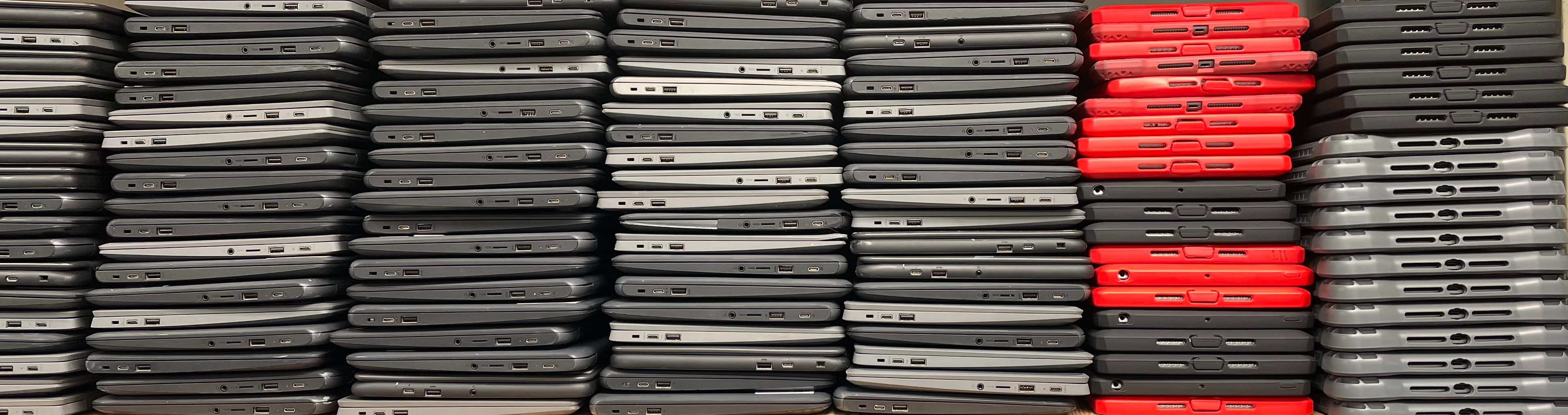Stacks of Chromebooks and iPads