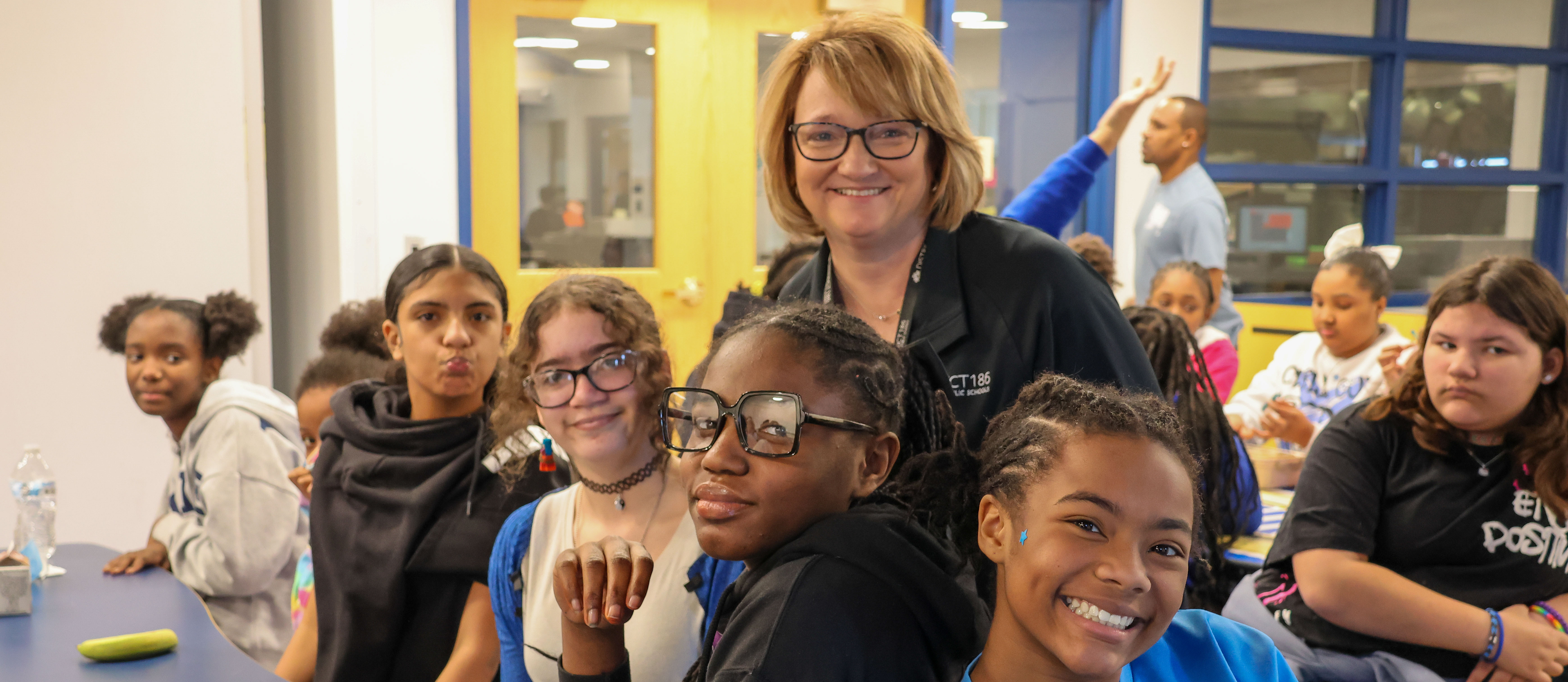 students smiling with superintendent 