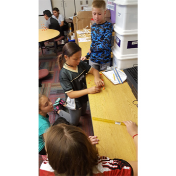 Kids putting candy together