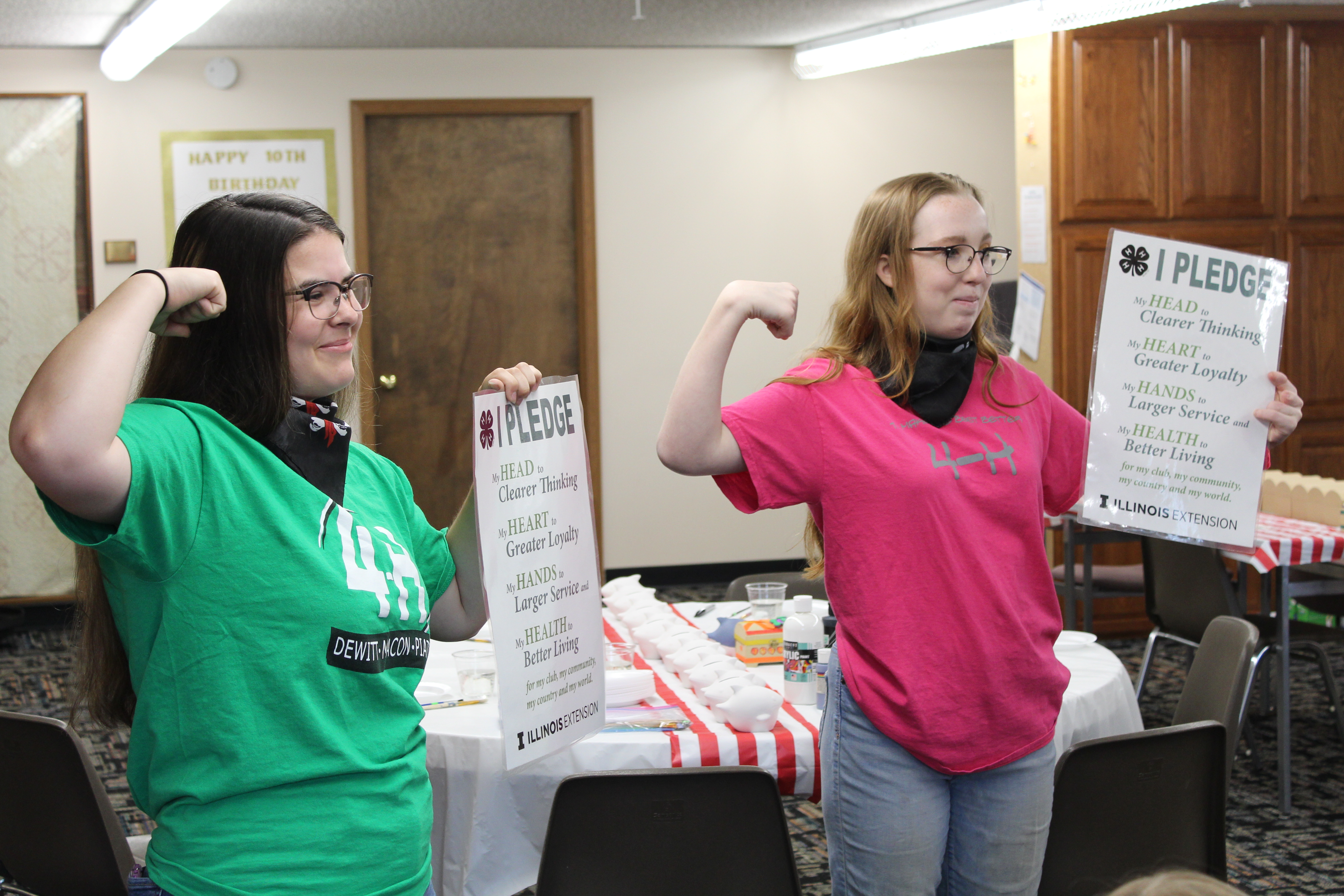 students flexing their muscles for 4-H