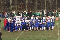 Football team huddled on the feild