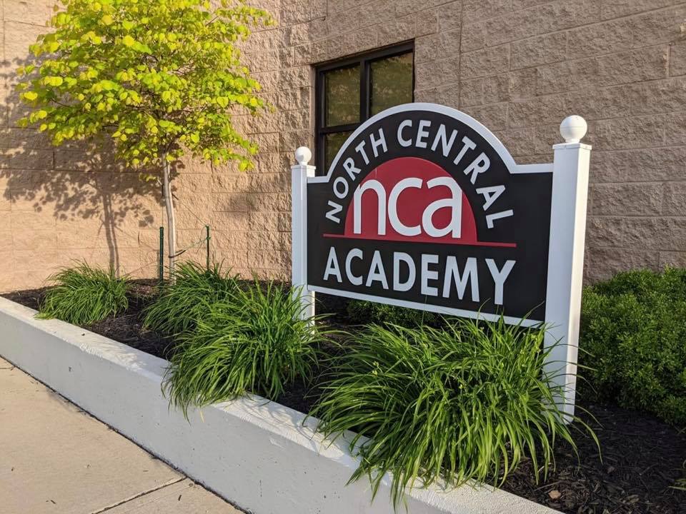 North Central Academy sign outside of school building 