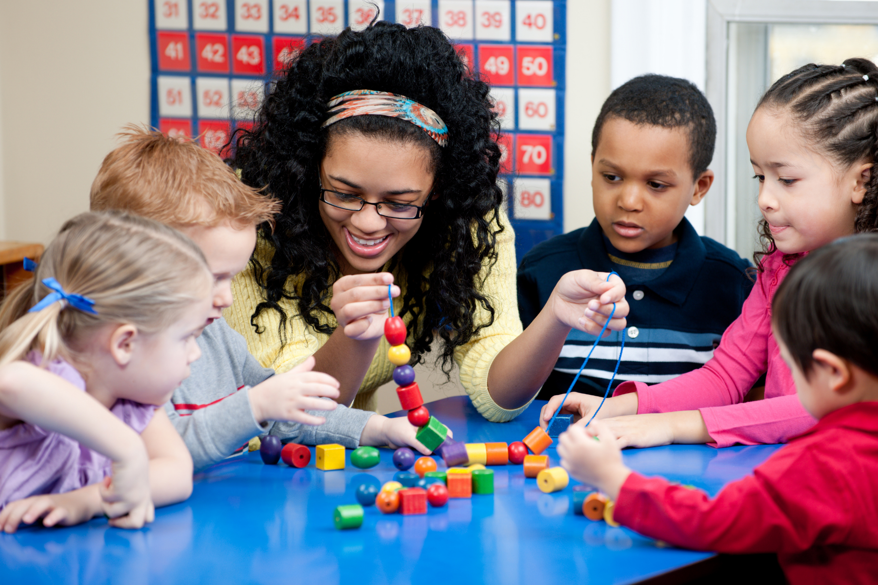 Teacher and five students crafting