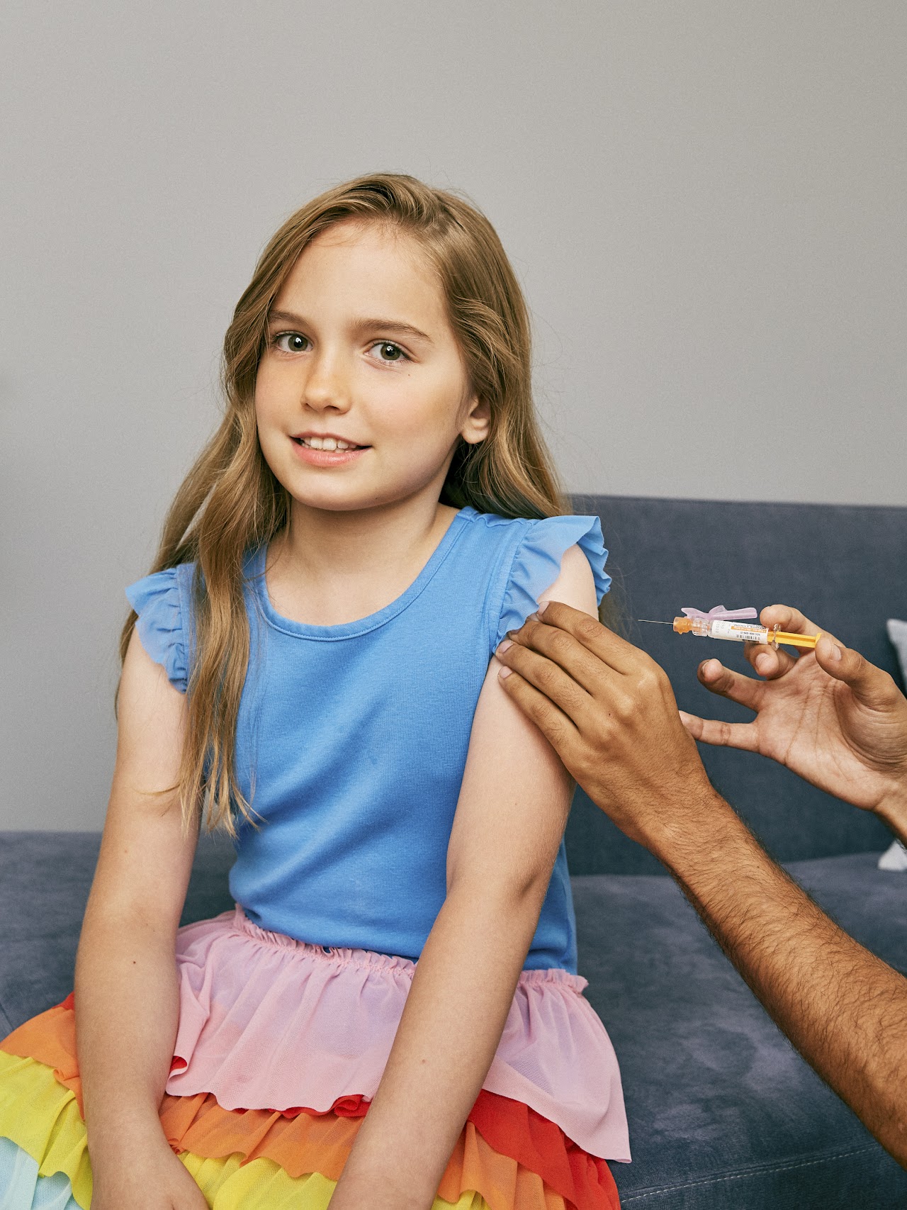 Young_girl_about_to_receive_a_vaccine_in_her_upper_arm_(48545990252)