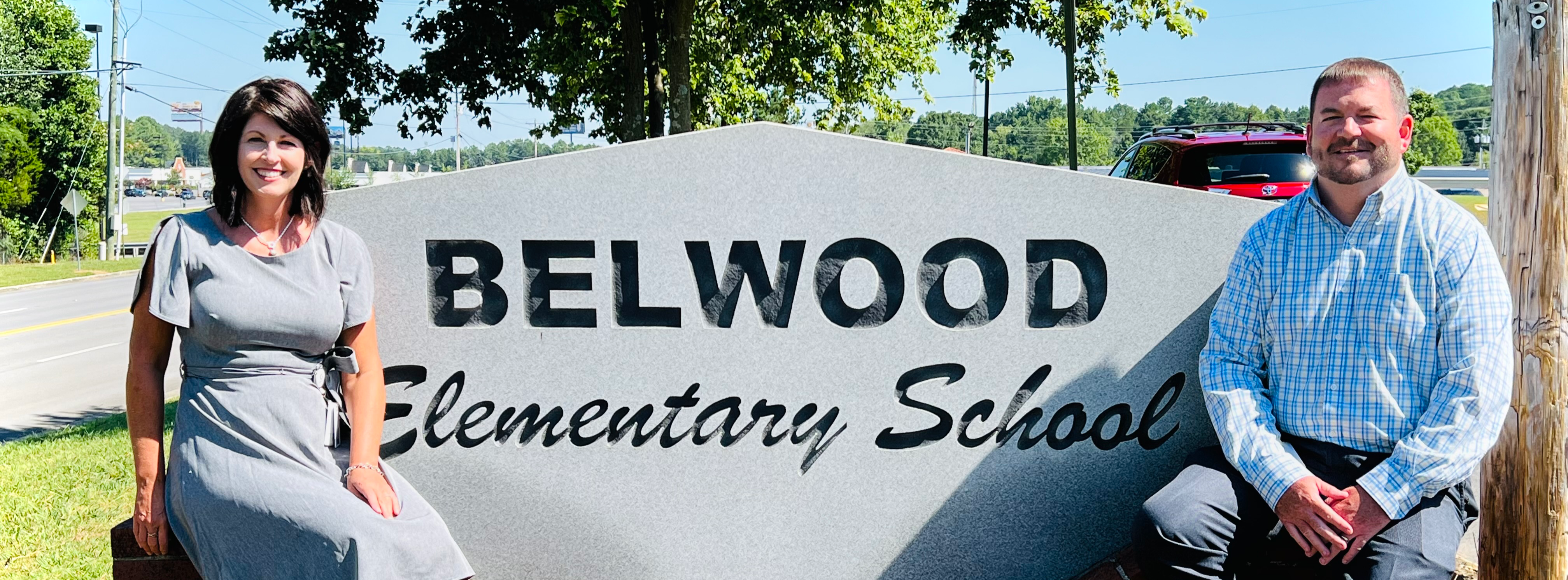 Principal and AP by Belwood sign
