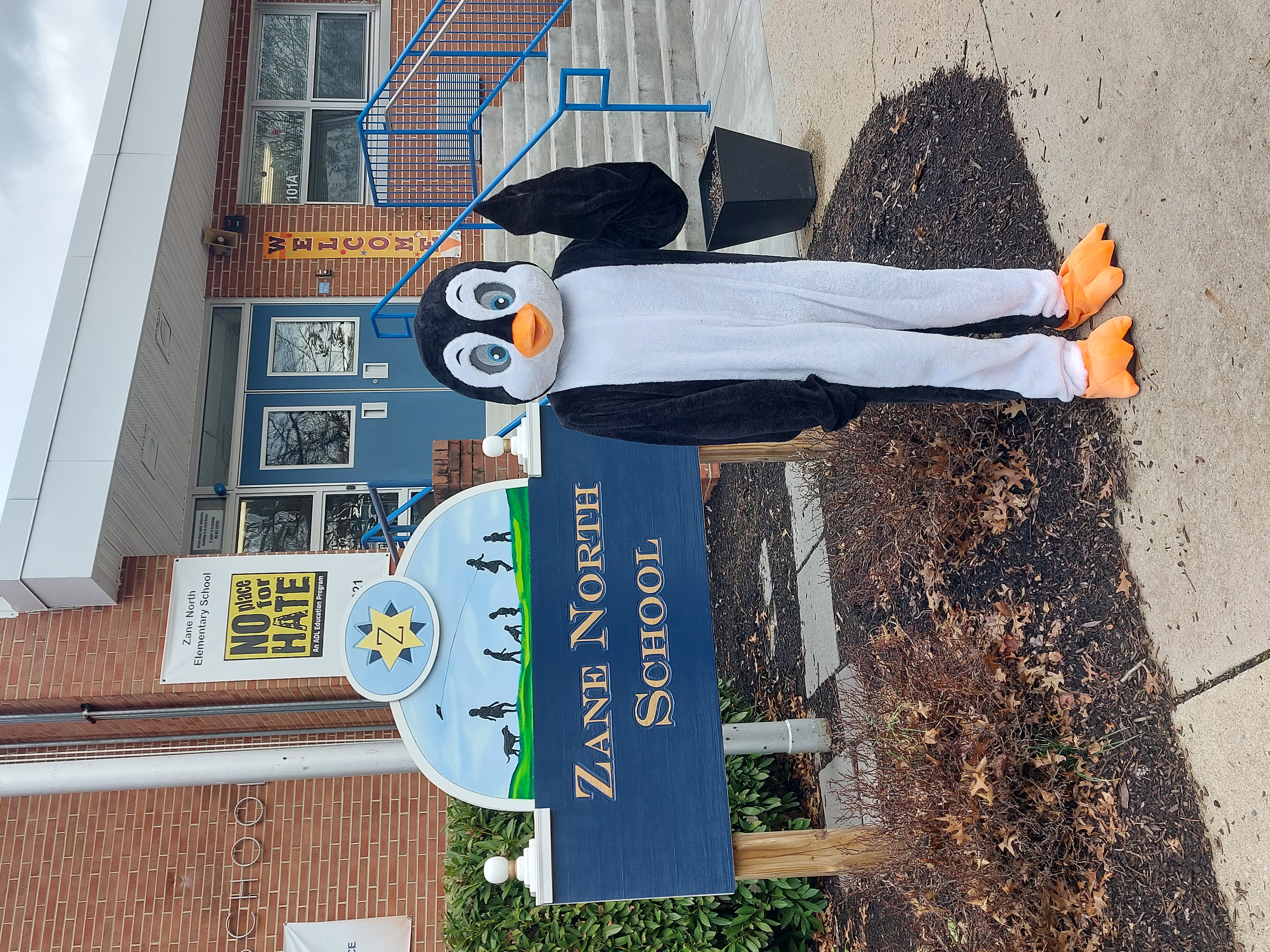 Pogo the penguin stands outside of Zane North's preschool location 