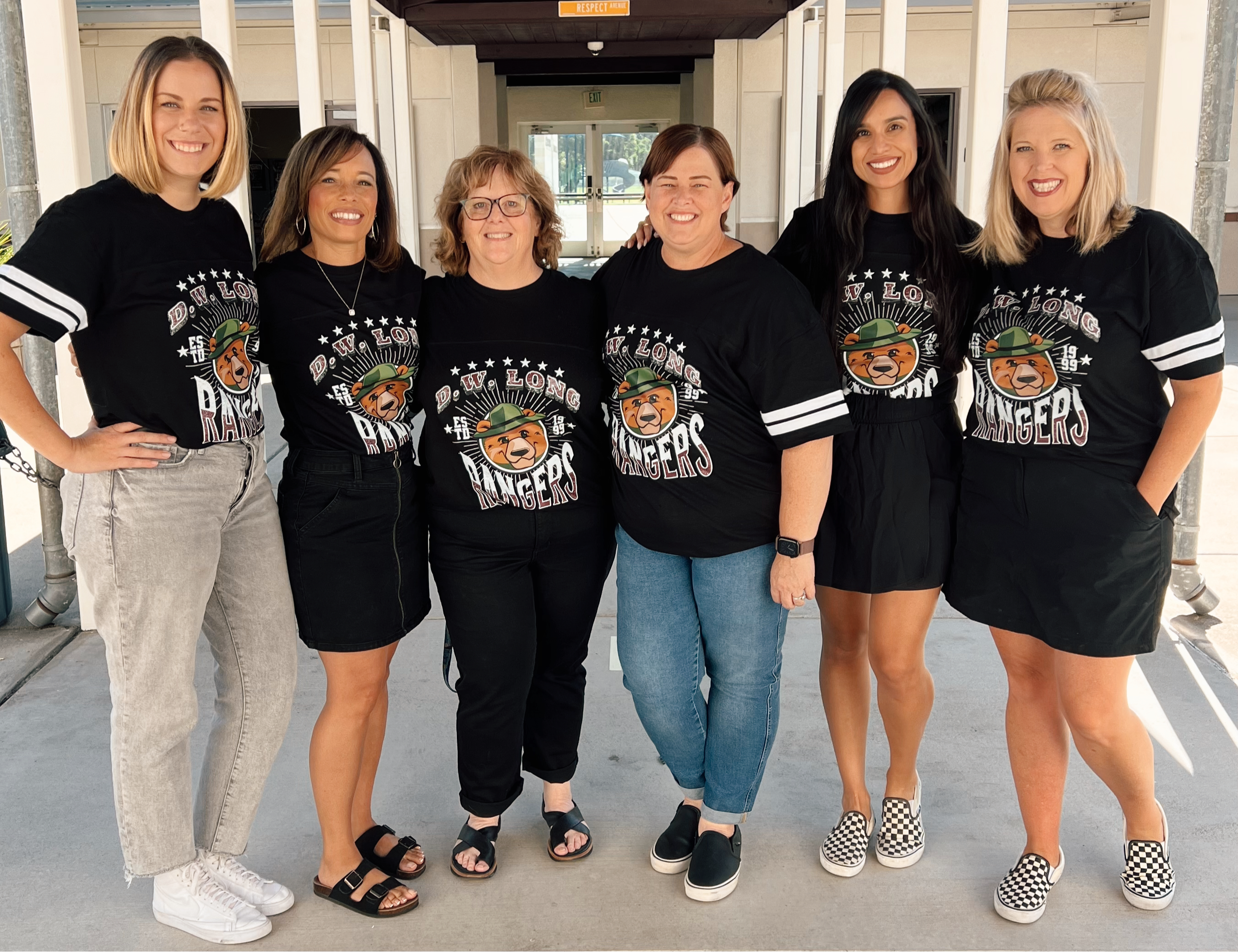 third grade teachers smiling outside