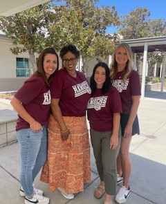 all of the second grade teachers smiling together