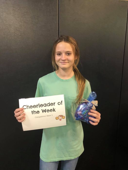 Kiley Jones with her award for Cheerleader of the Week