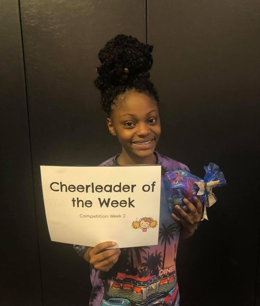 Jada King receiving her award for Cheerleader of the Week