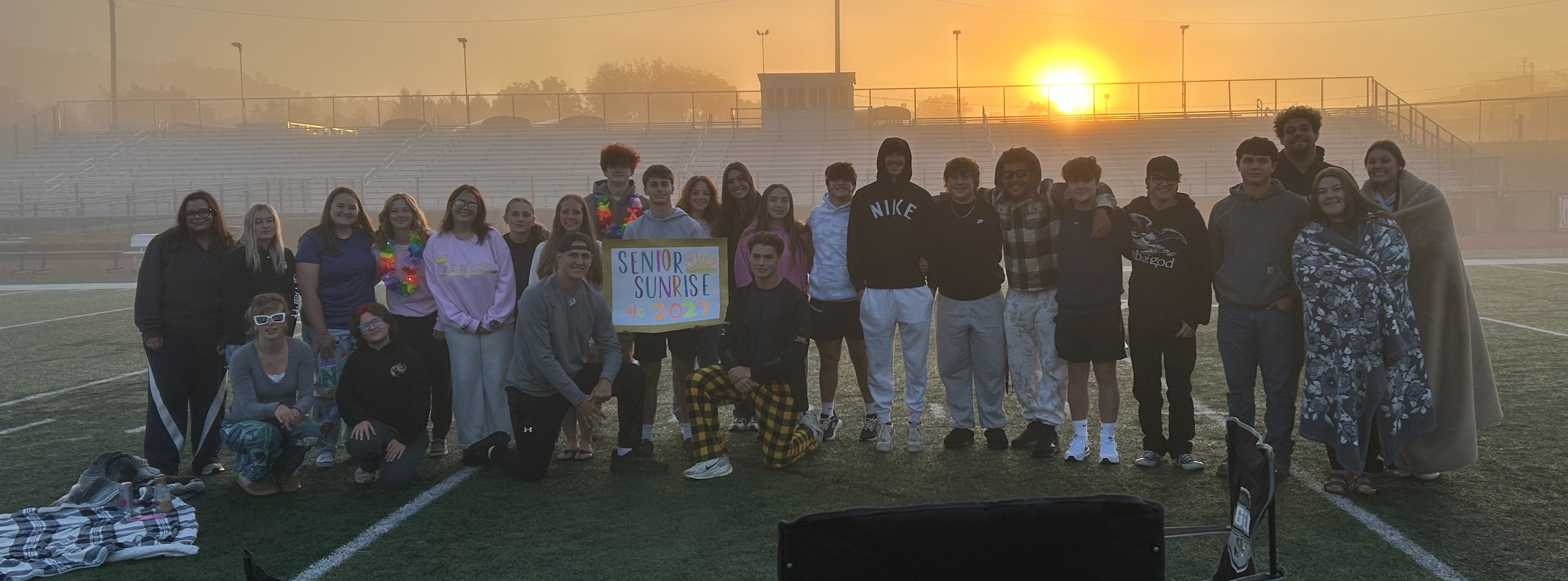 senior sunrise on football field