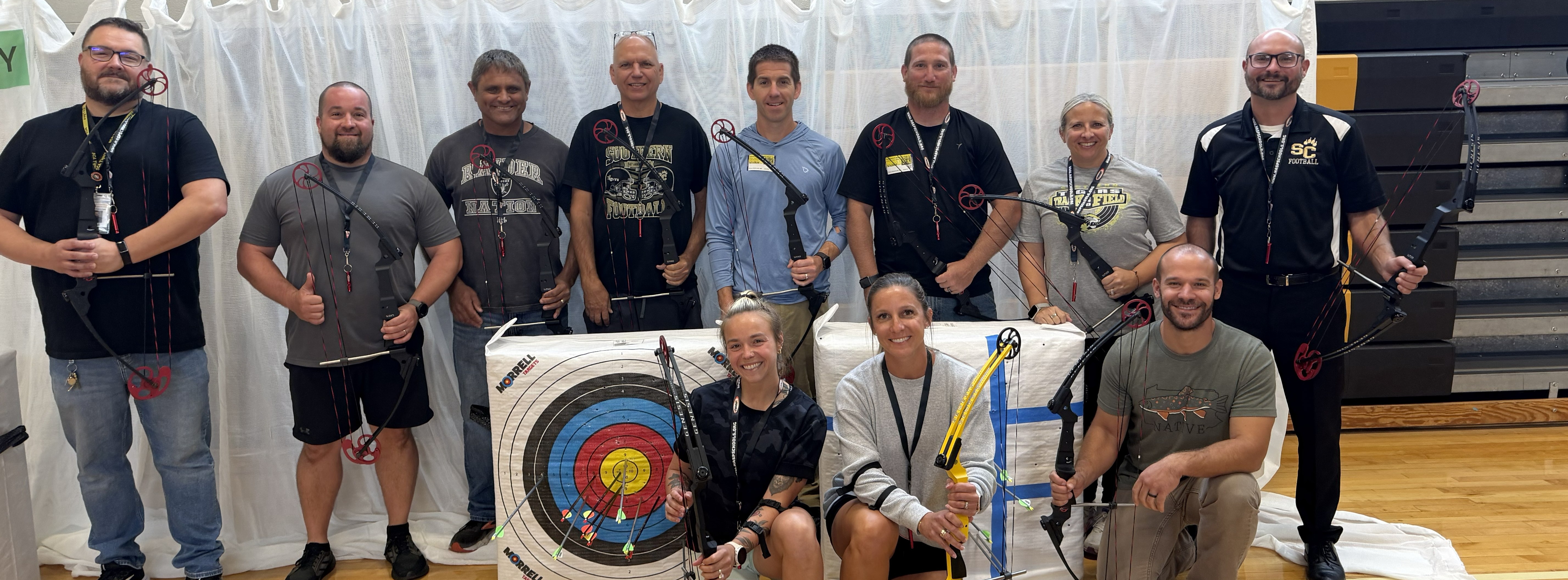 photo of teachers participating in archery training