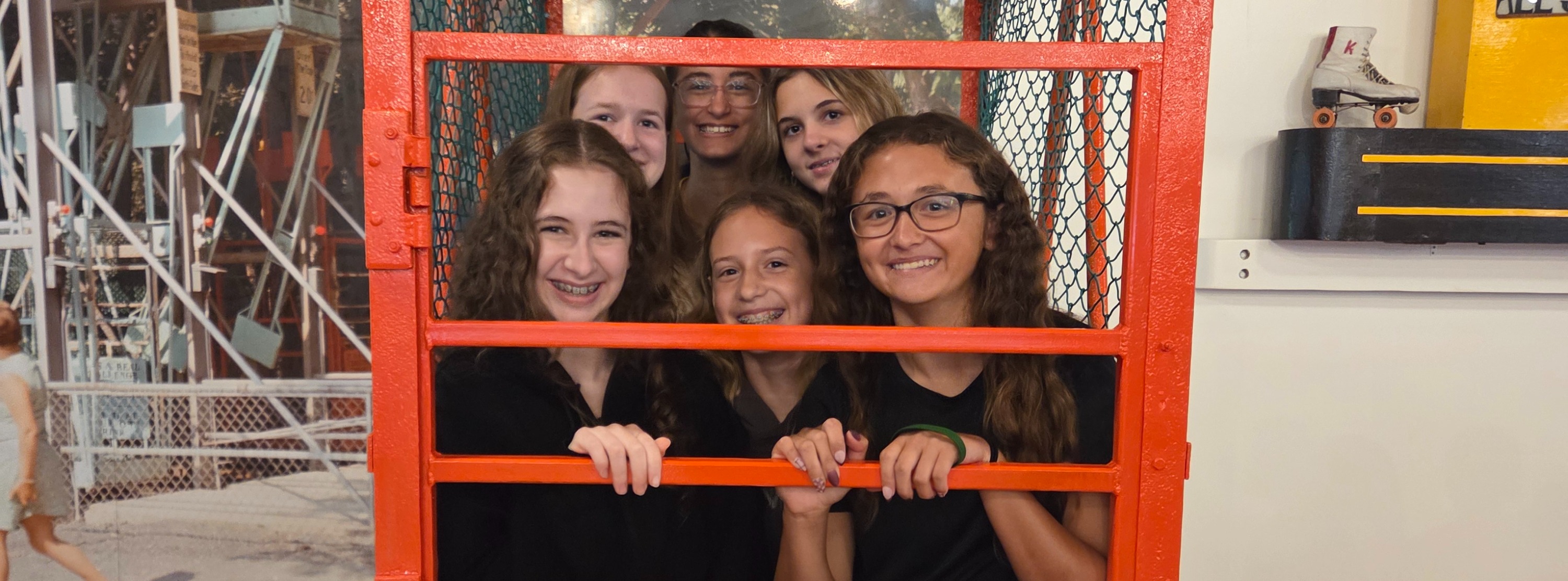 students learning at an amusement park