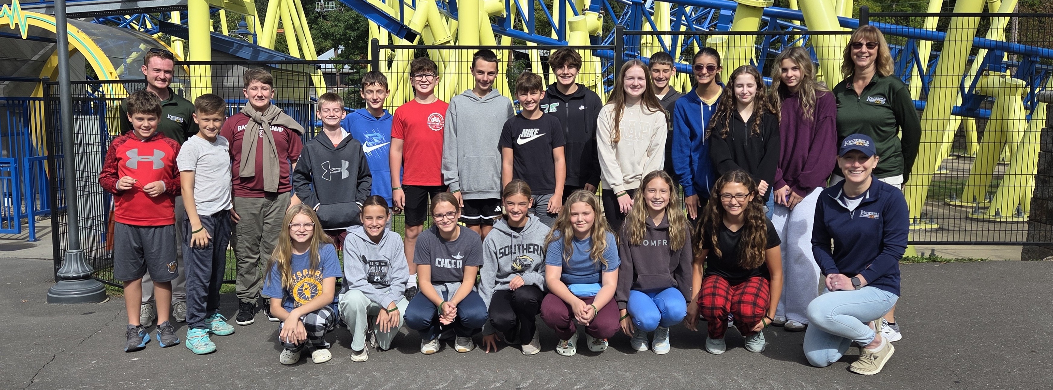 students learning at an amusement park