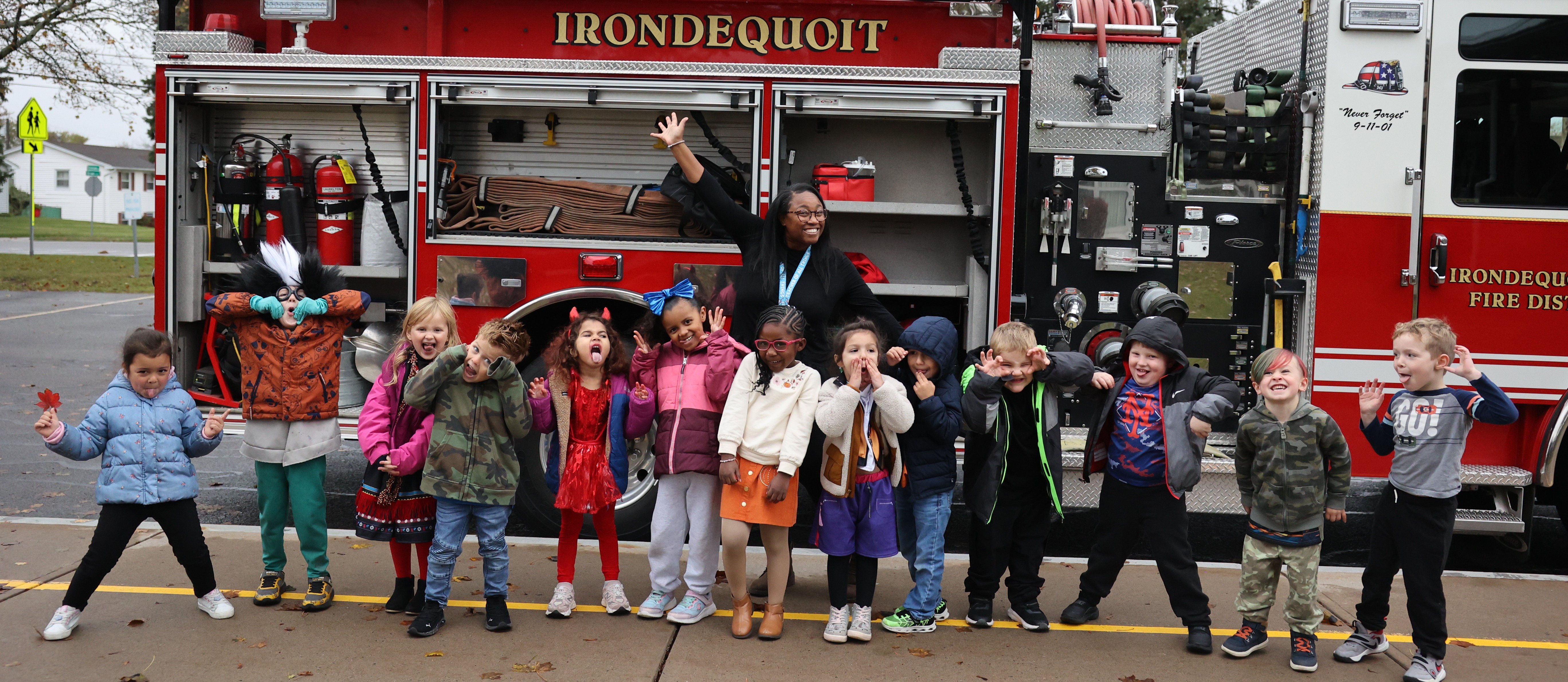 Students pose in front of fire truck