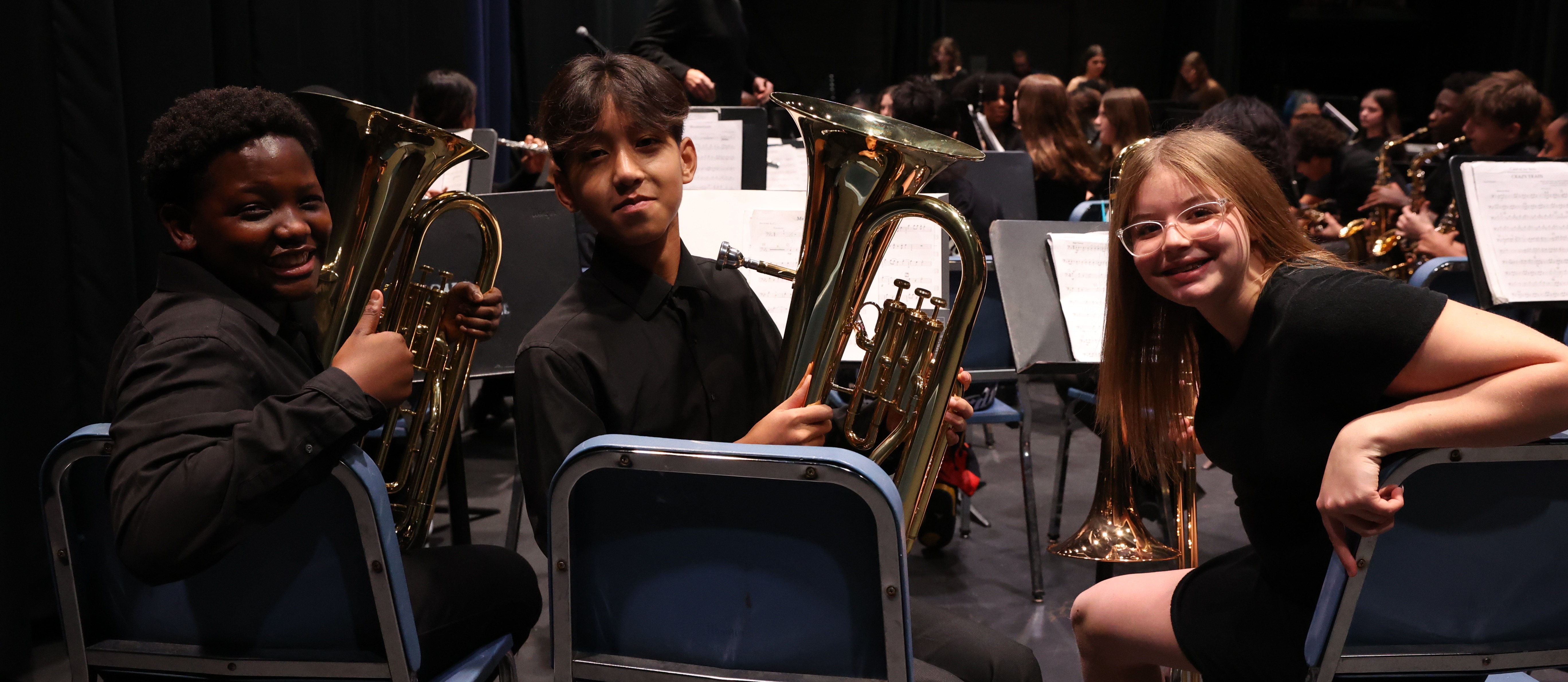 students pose with instruments