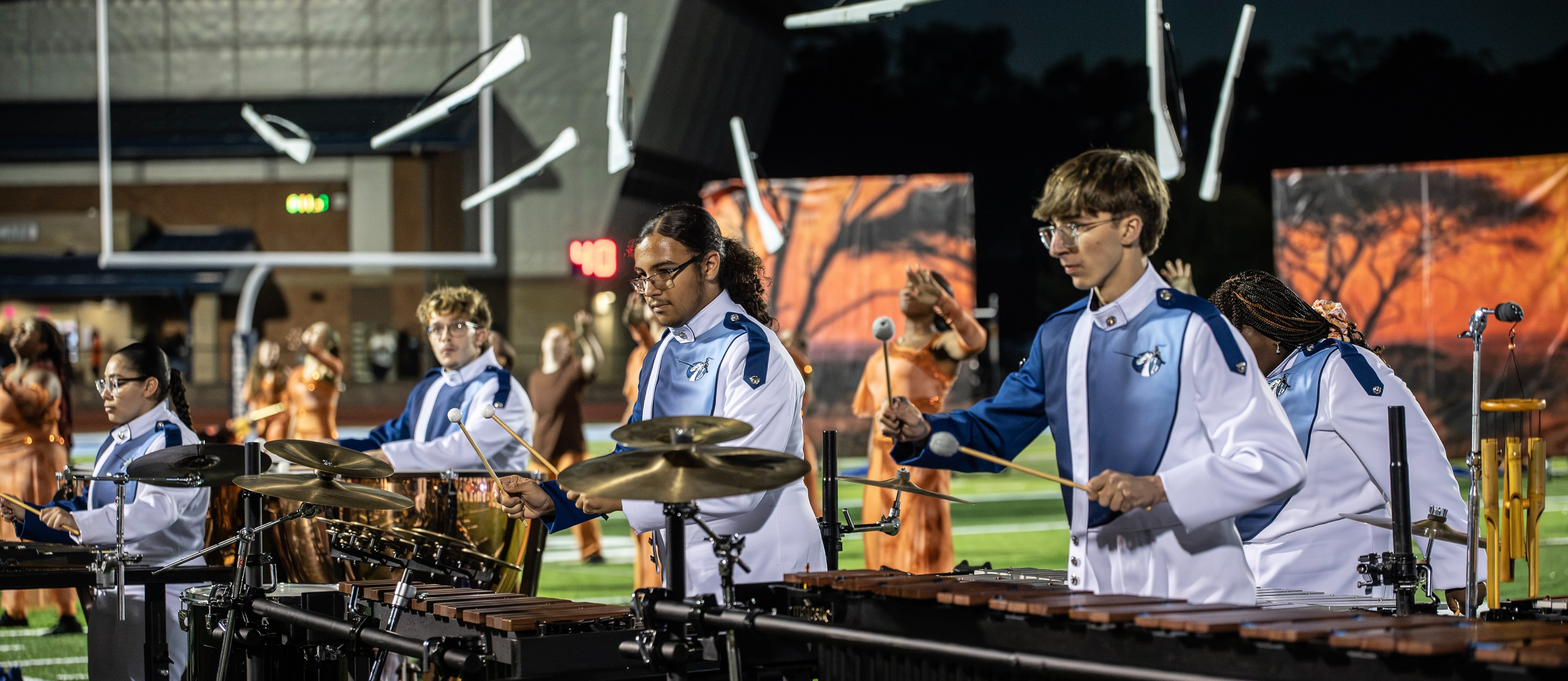Students perform band show on field