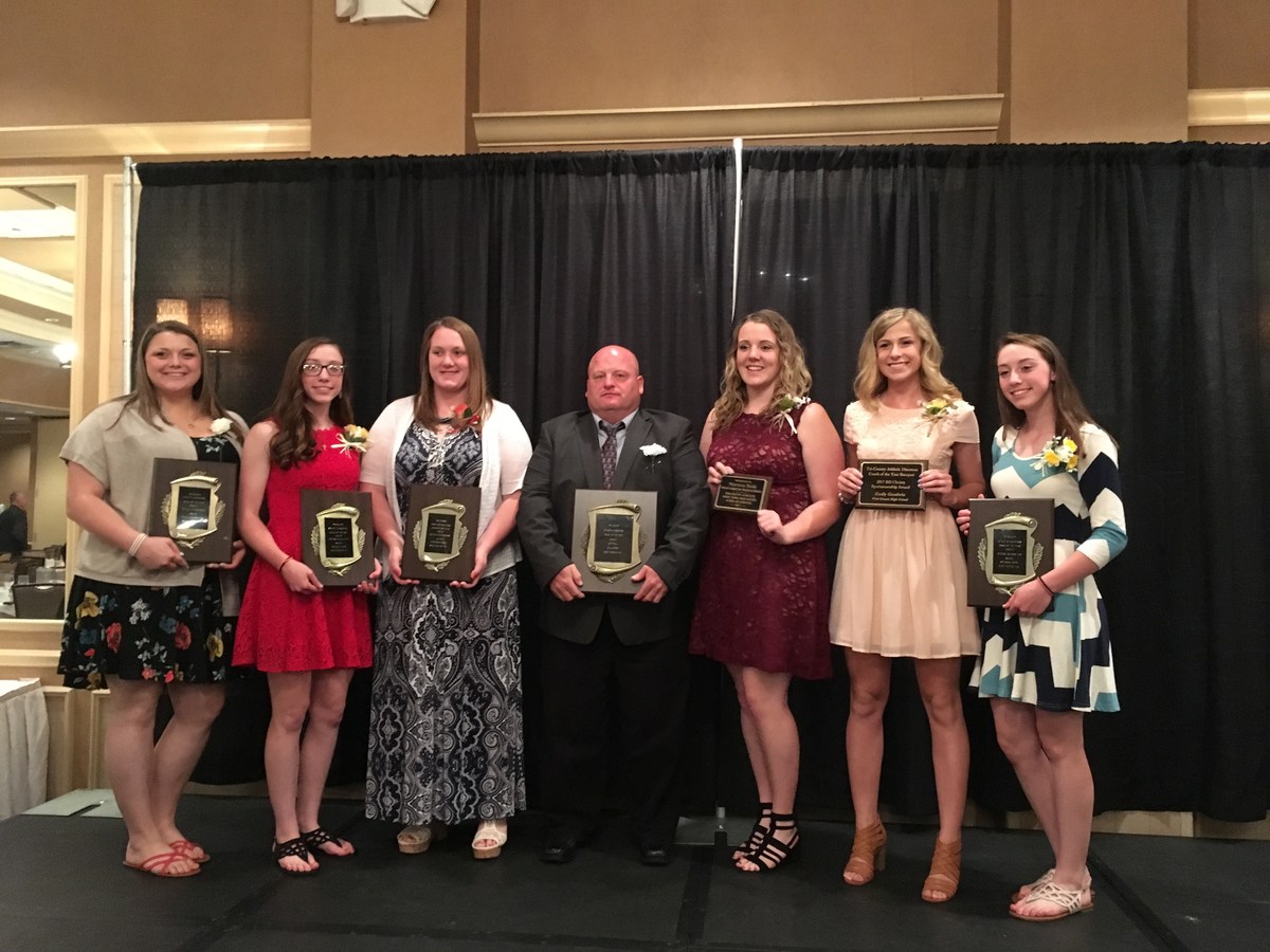 photo of students and teachers holding up awards