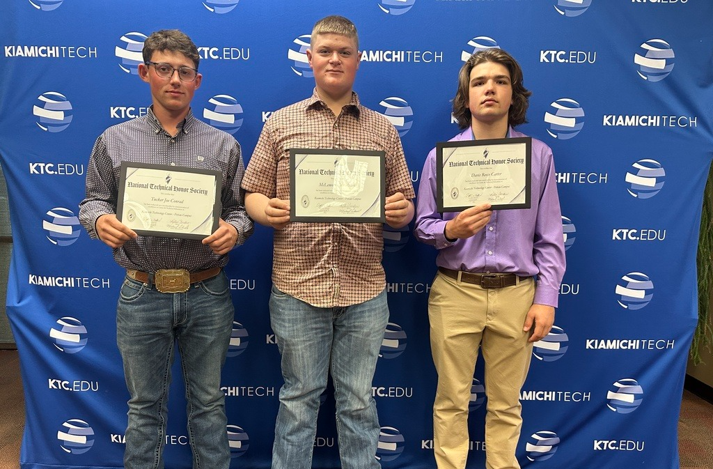Three Spiro students pose with certificates from technical 