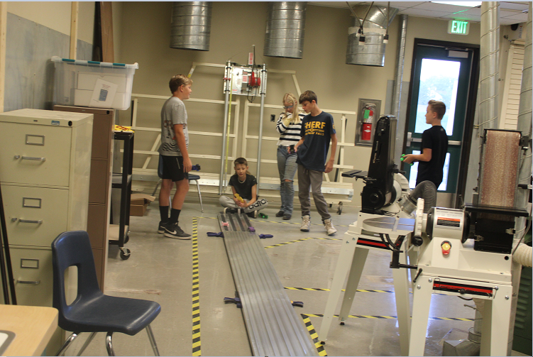 Students racing cars in Mr. Segler's class