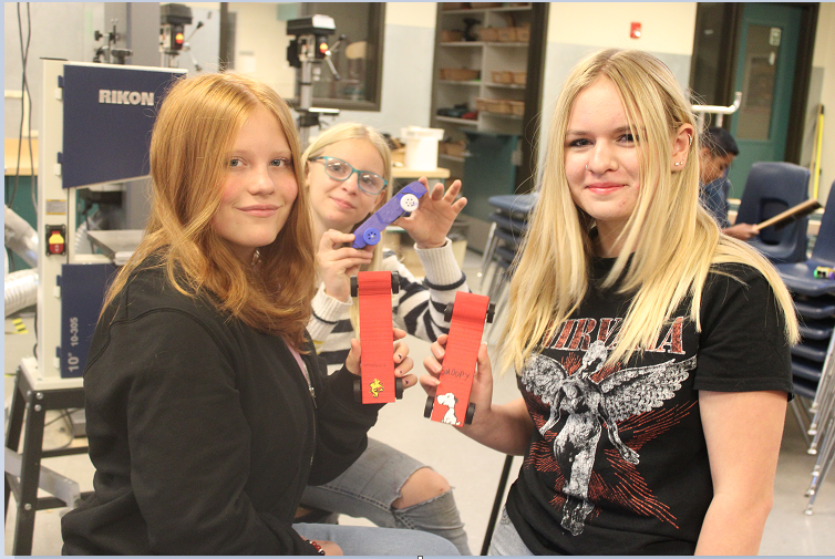 Students racing cars in Mr. Segler's class