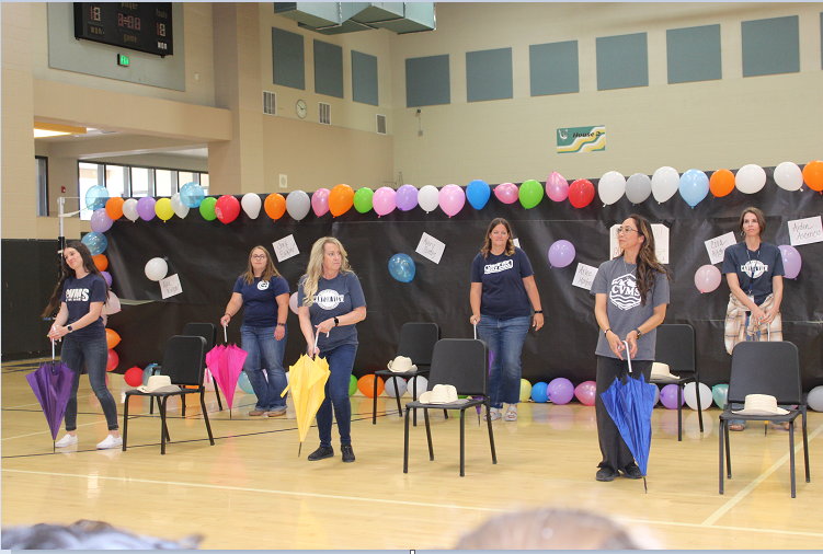 teachers performing  at annual talent show