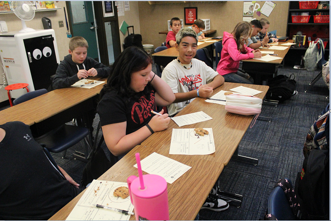 students practicing cookie archeology