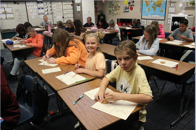 students practicing cookie archeology