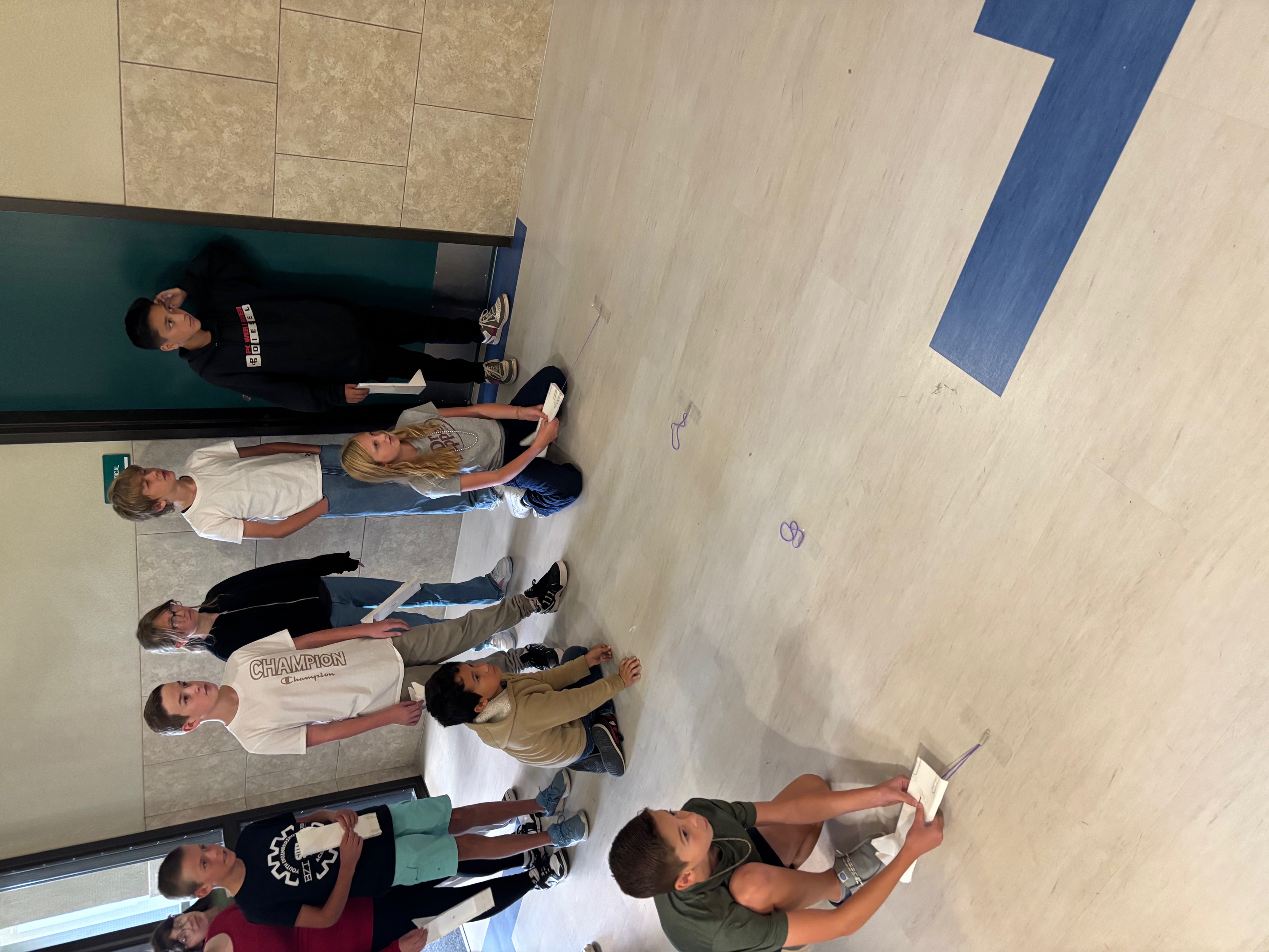 students racing skimmers