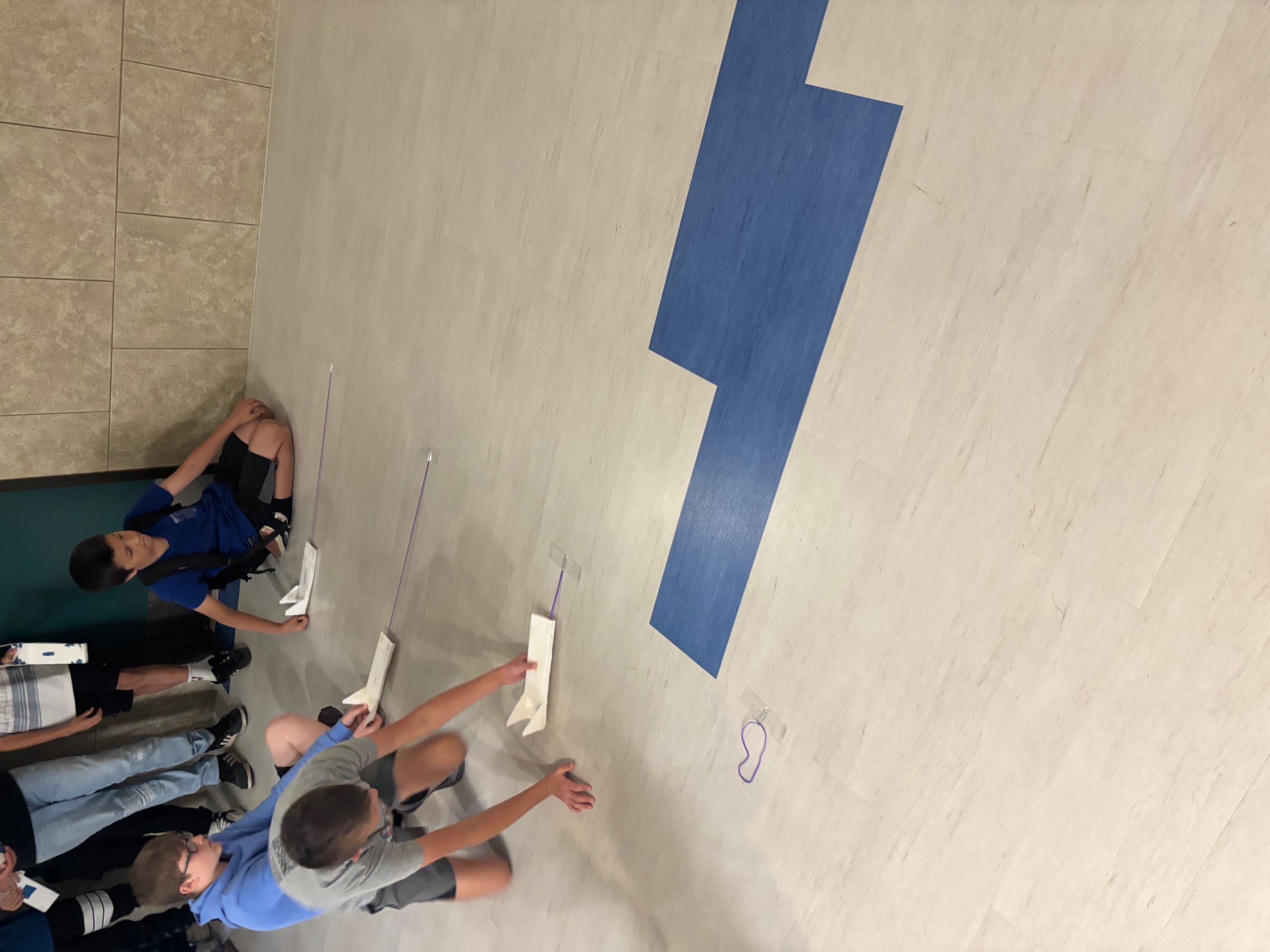 students racing skimmers