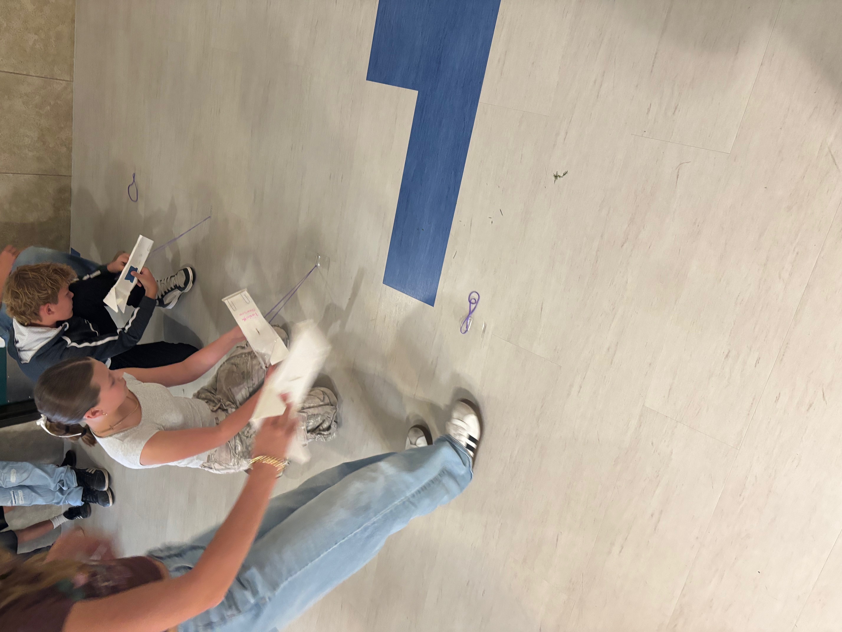 students racing skimmers