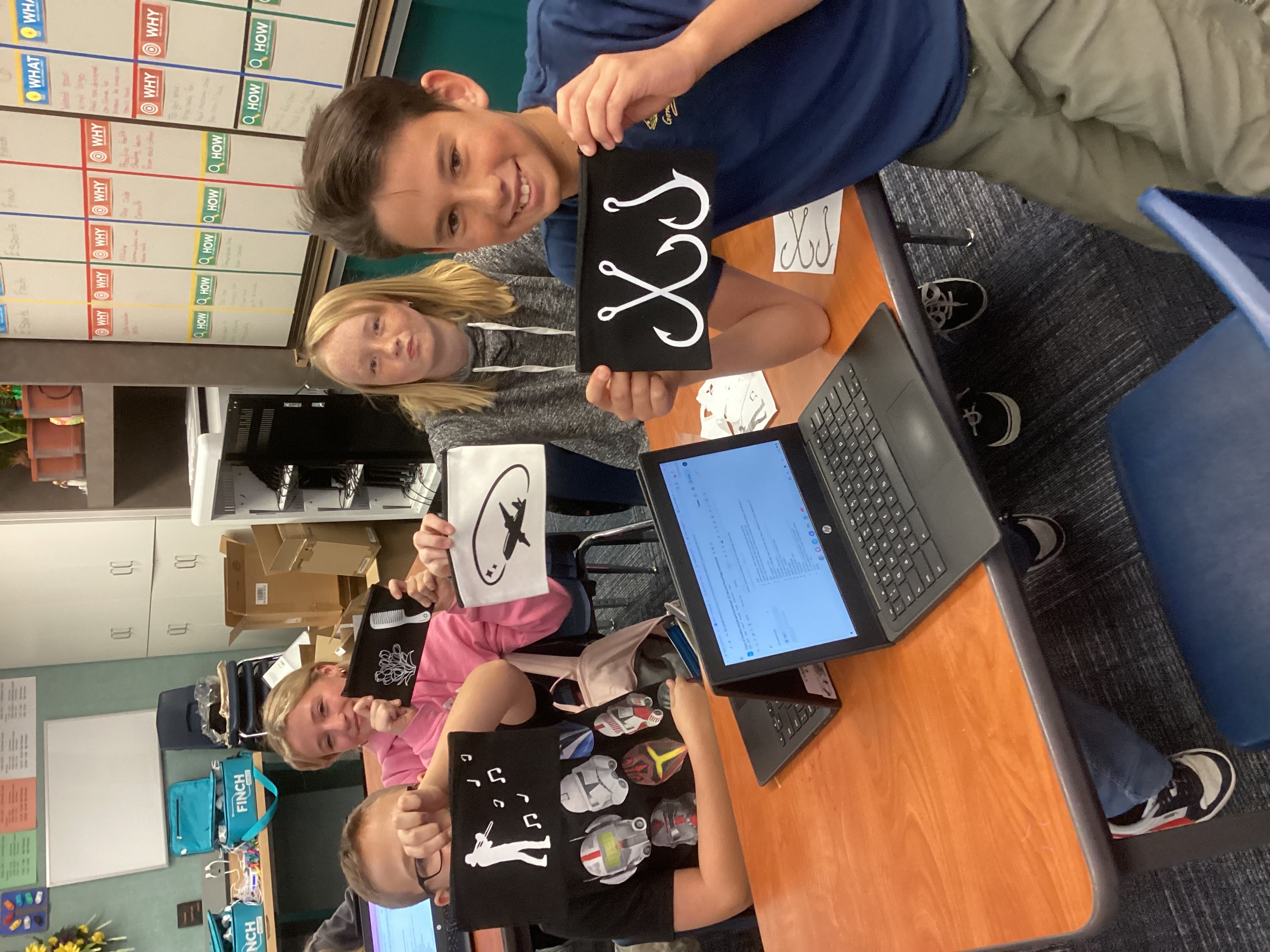 Students showing off pencil bags