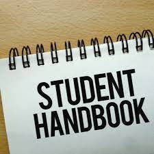 notebook with words "student handbook"