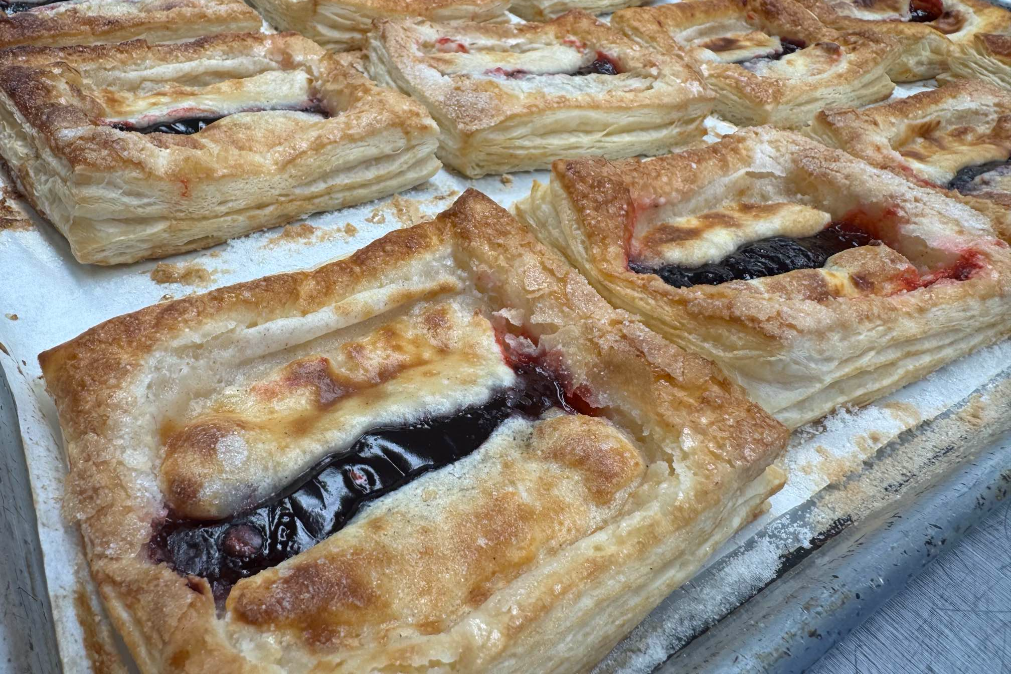 An up-close photo of raspberry Danishes 