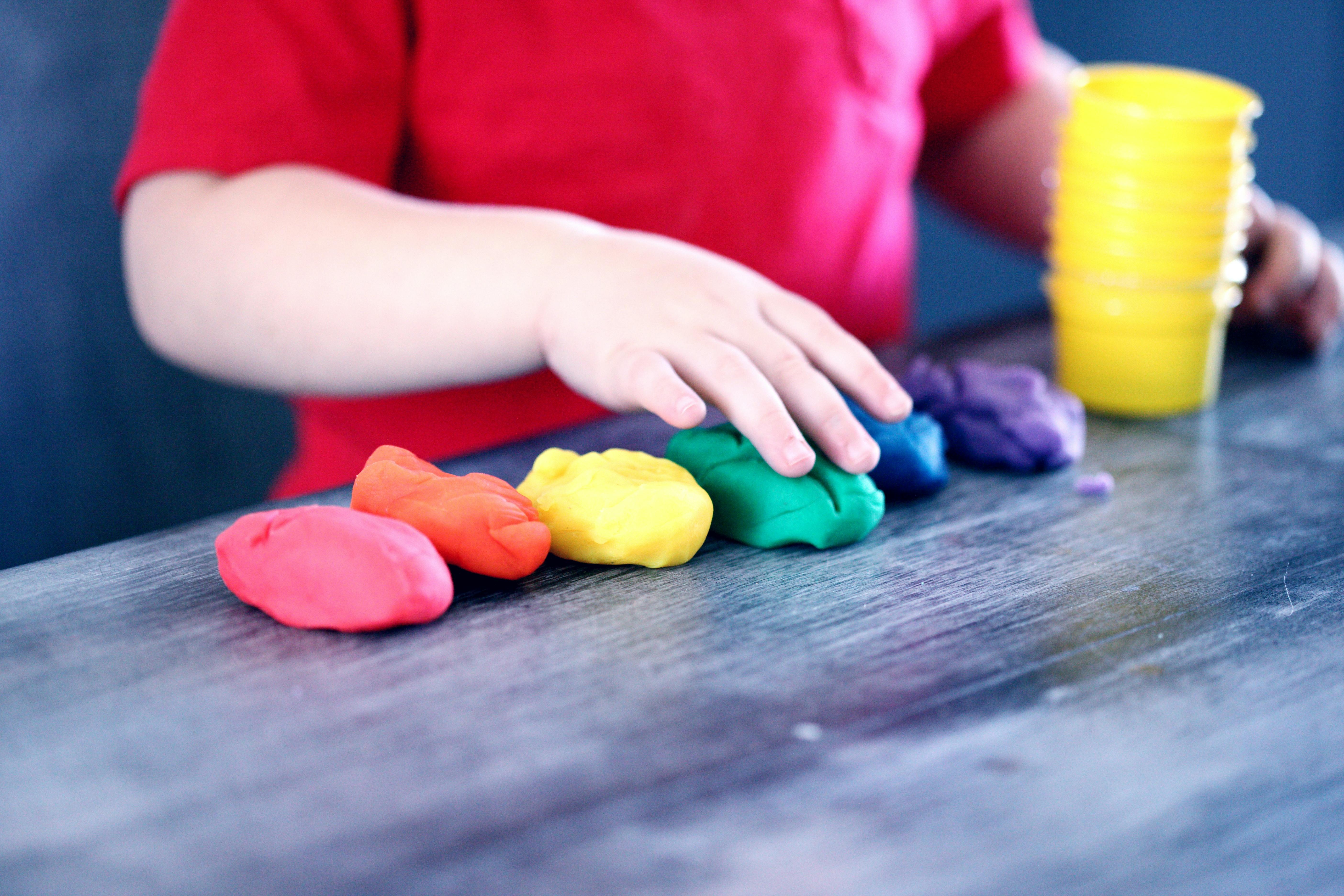 Student Playing with Clay