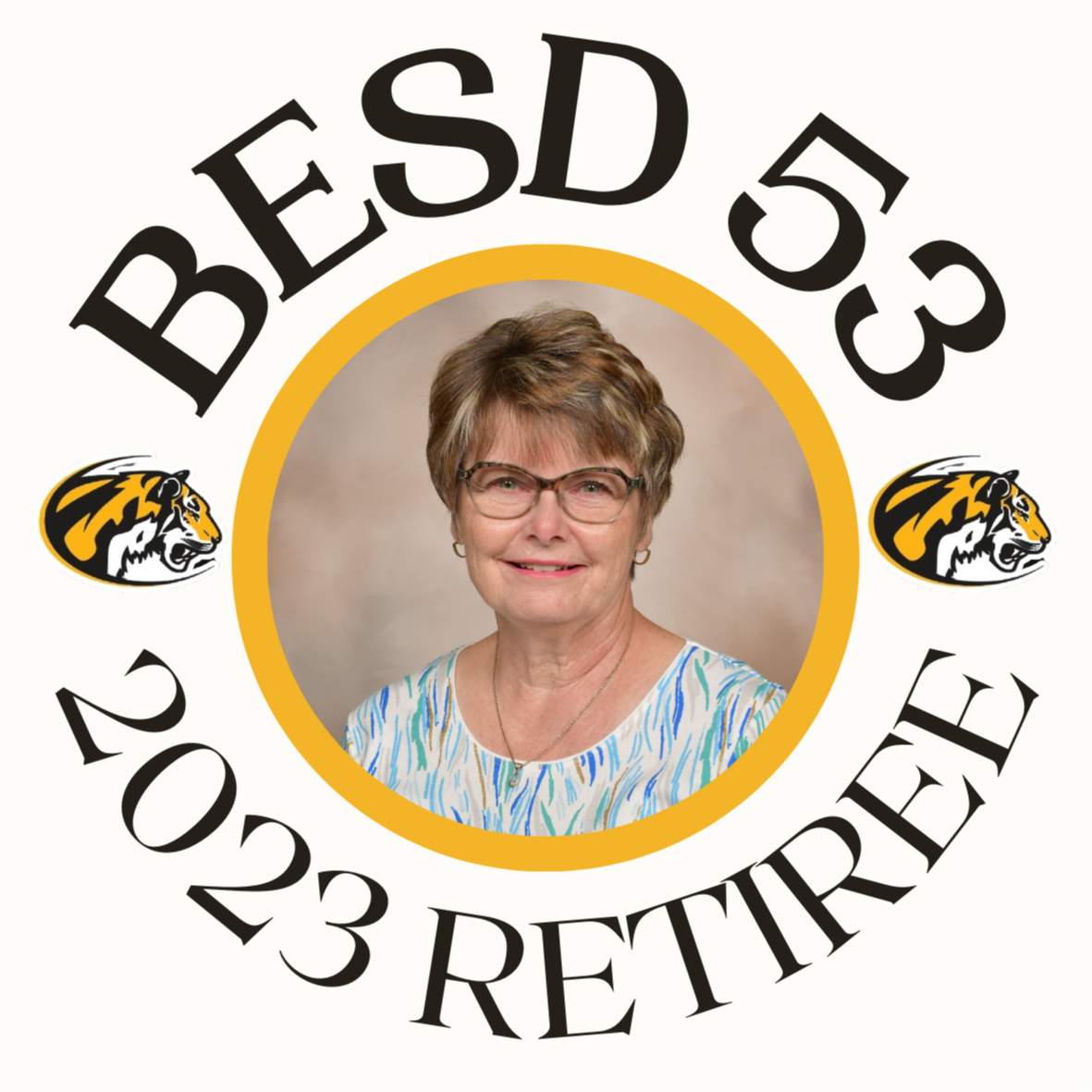 Circle image with words BESD 53 2023 RETIREE and photo of Woman with short hair and glasses in the center