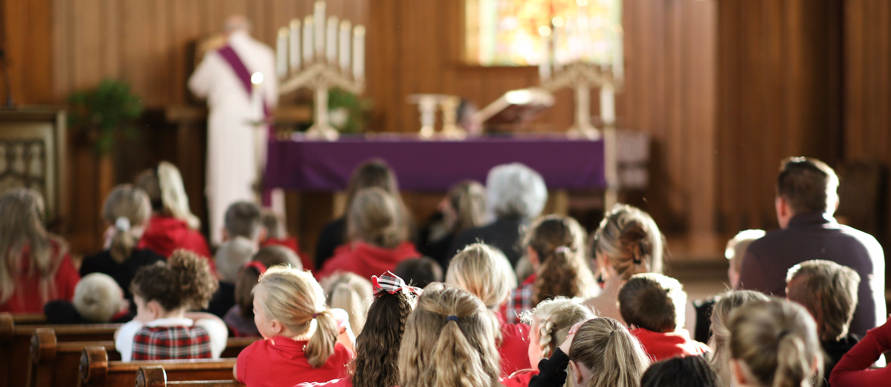 Students praying in church