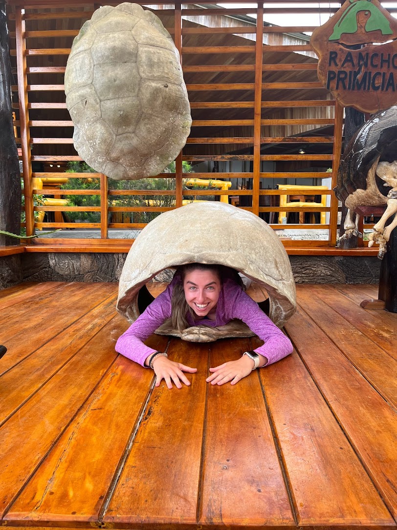 Miss Cornaglia inside of a Galapagos Tortoise shell
